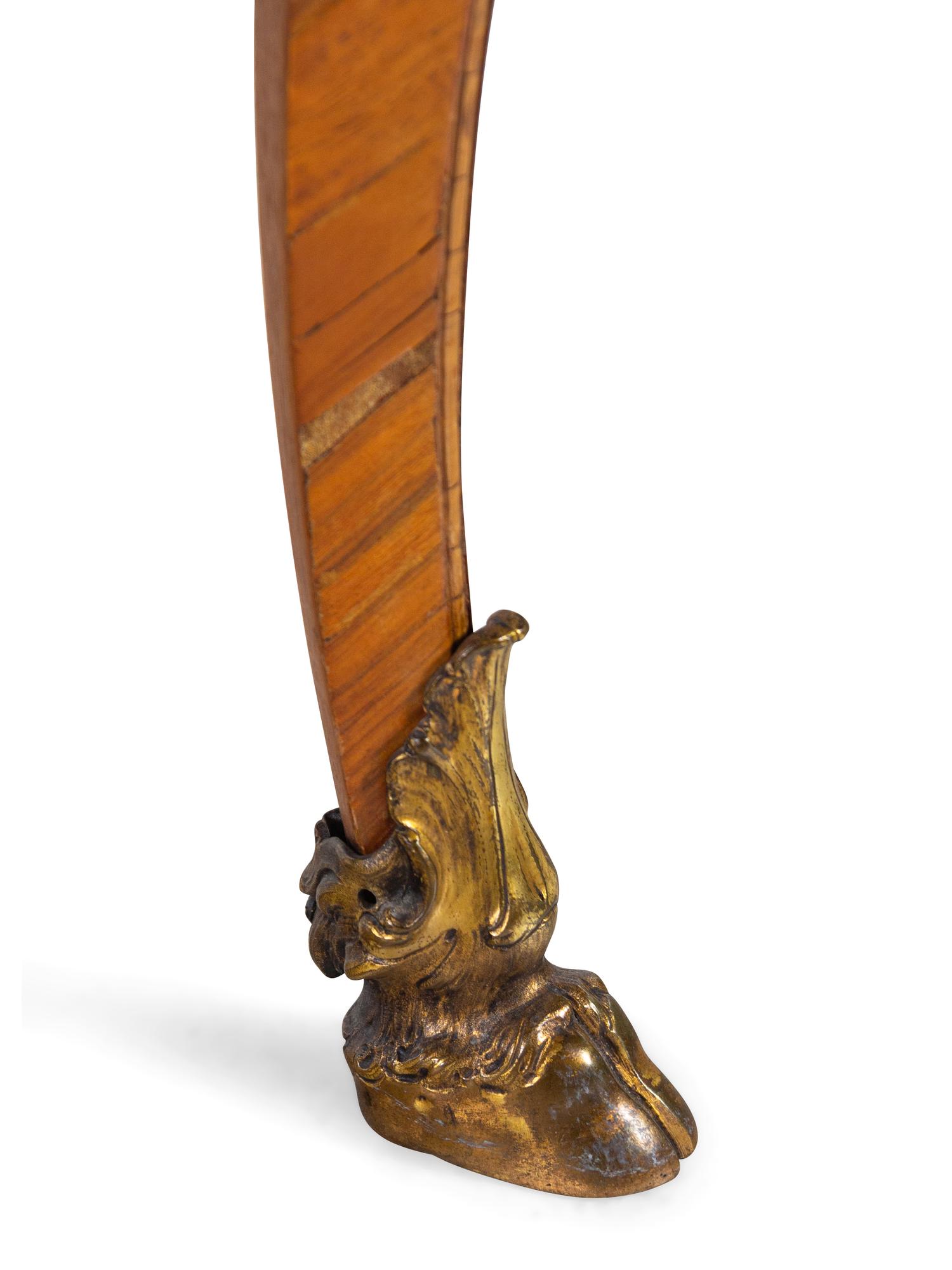 An Italian Rococo Style Gilt Metal Mounted Olivewood Desk and an Associated Chair
