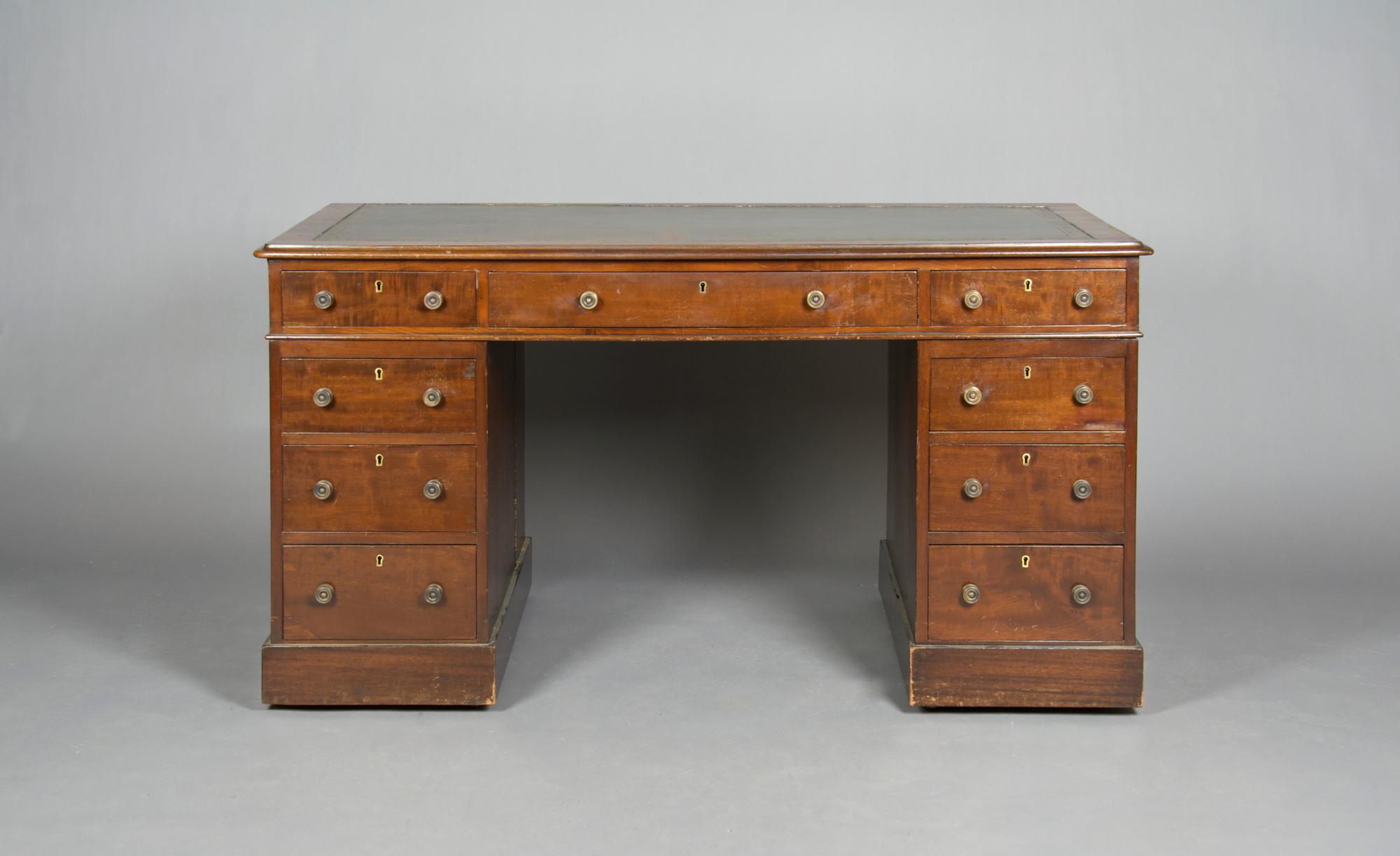 An English Mahogany Pedestal Desk, Height 28 x width 53 1/2 x depth 27 1/2 inches.