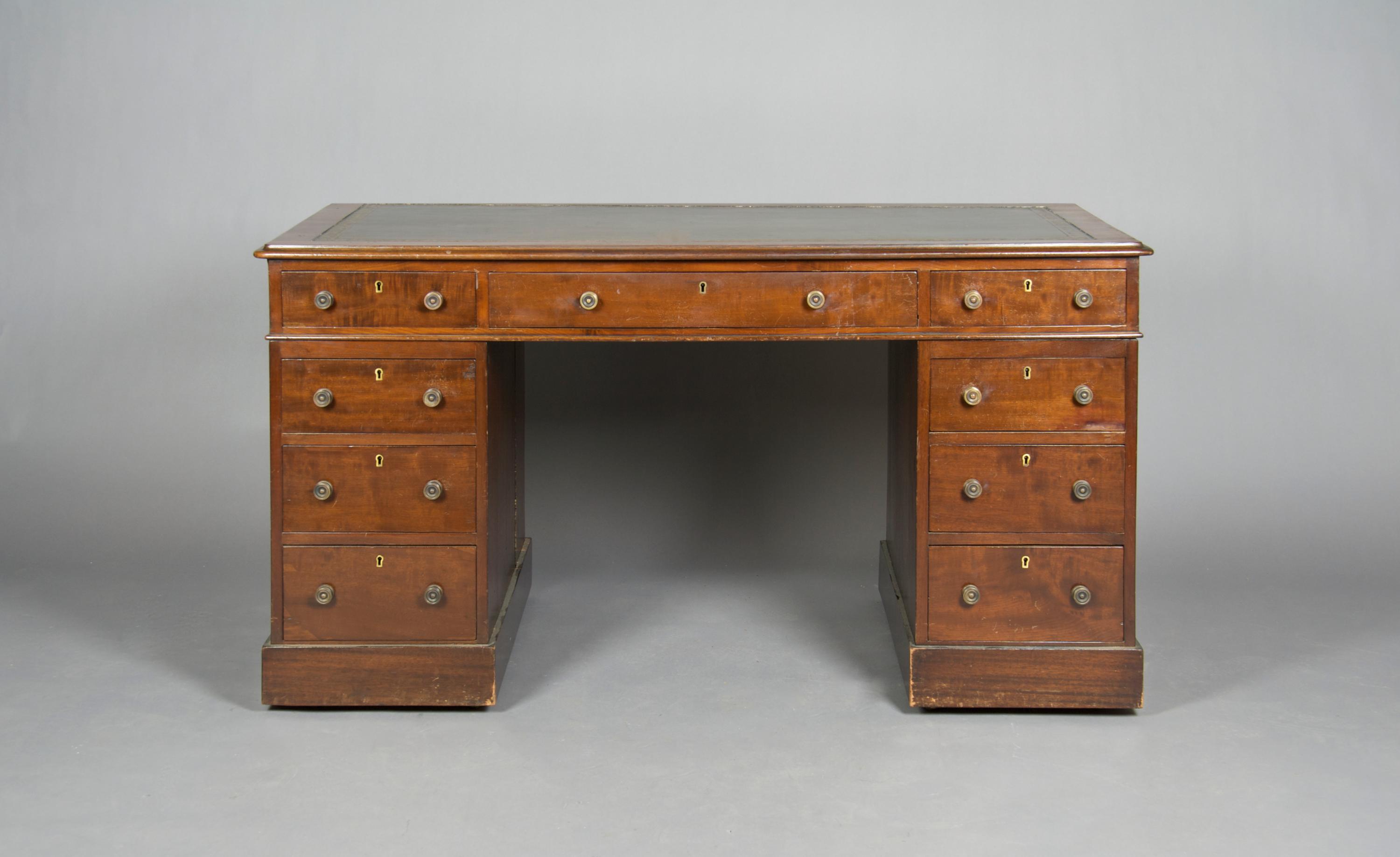 An English Mahogany Pedestal Desk, Height 28 x width 53 1/2 x depth 27 1/2 inches.