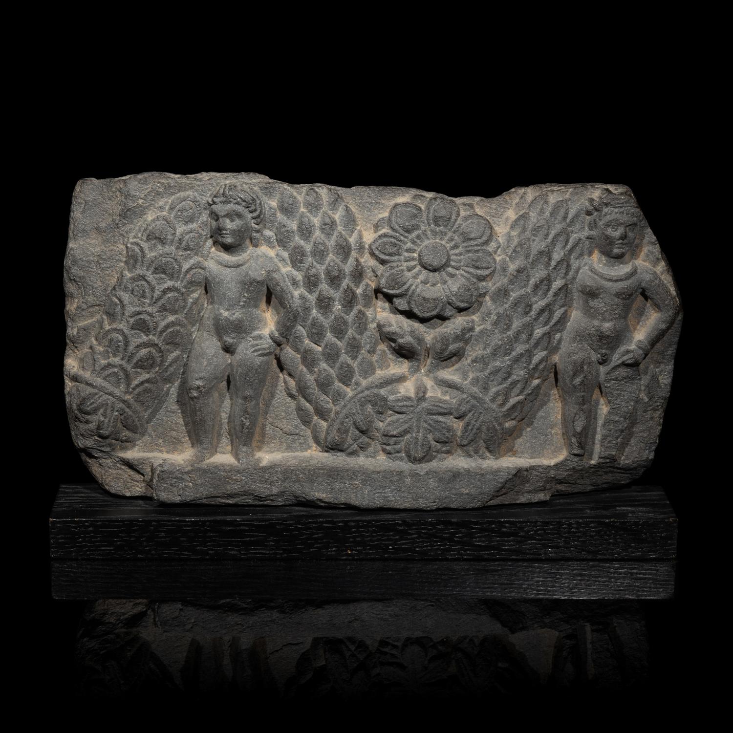 A Gandharan Grey Schist Relief of Garland Bearers, 2nd-3rd Century