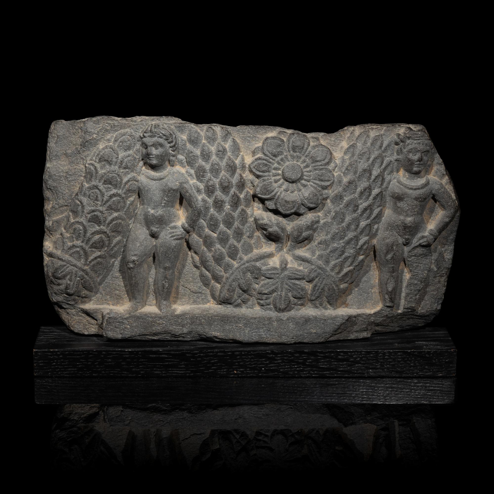 A Gandharan Grey Schist Relief of Garland Bearers, 2nd-3rd Century