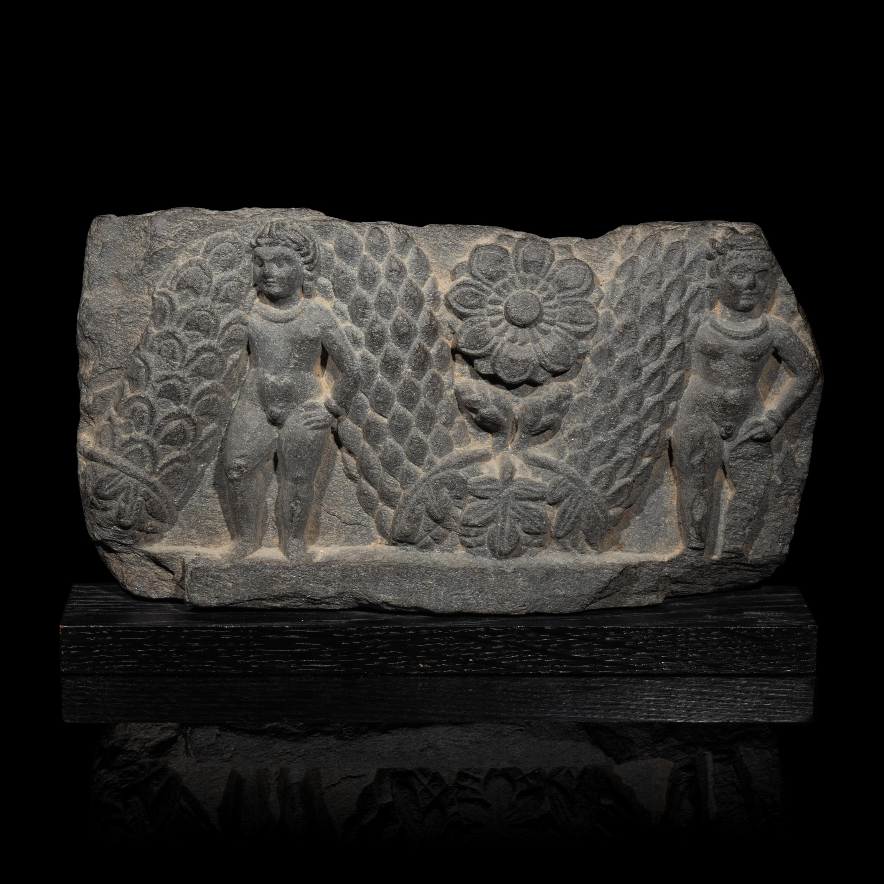 A Gandharan Grey Schist Relief of Garland Bearers, 2nd-3rd Century