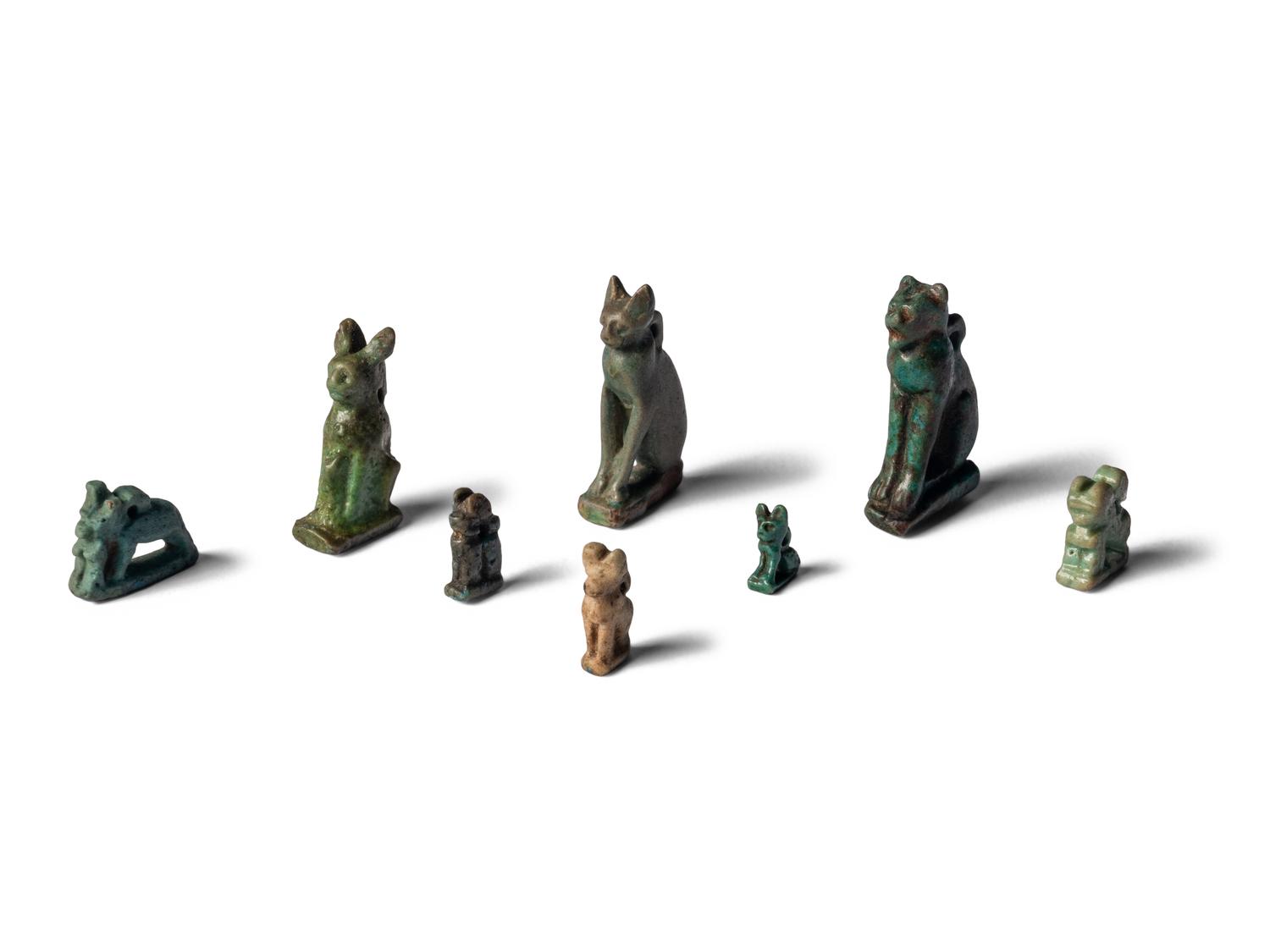 Eight Egyptian Faience Bastet Amulets