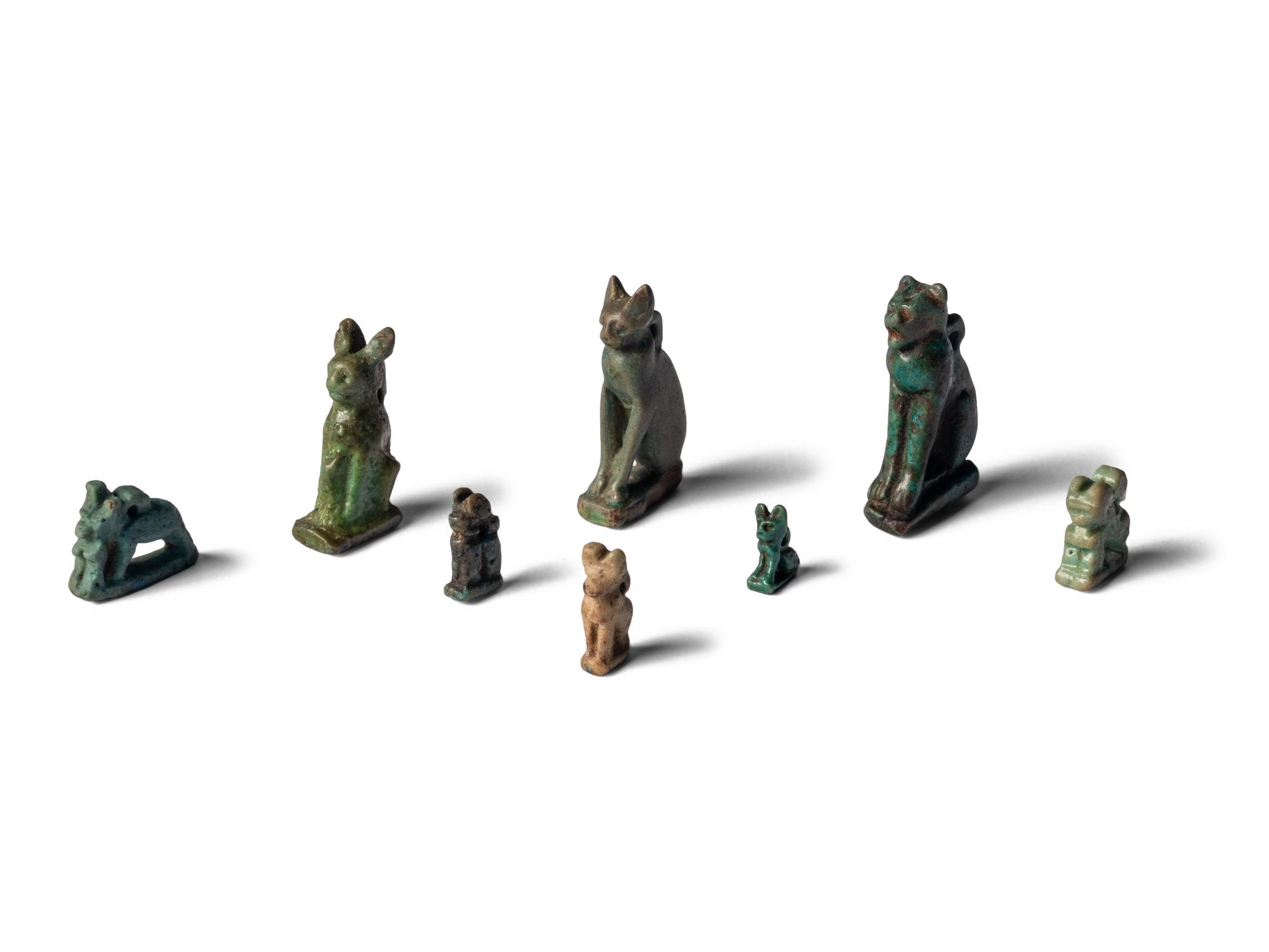 Eight Egyptian Faience Bastet Amulets