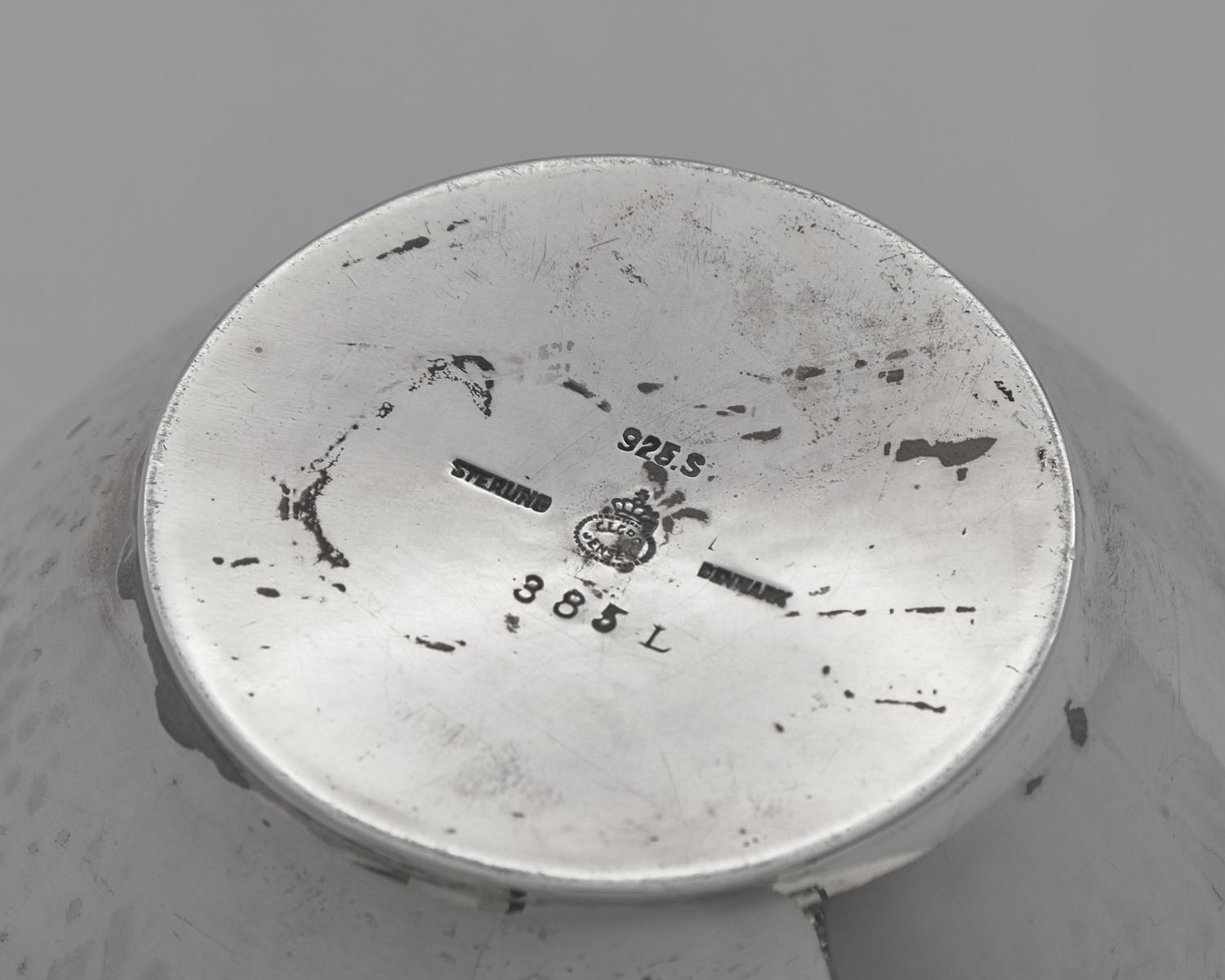 A Group of Four Georg Jensen Silver Pitchers