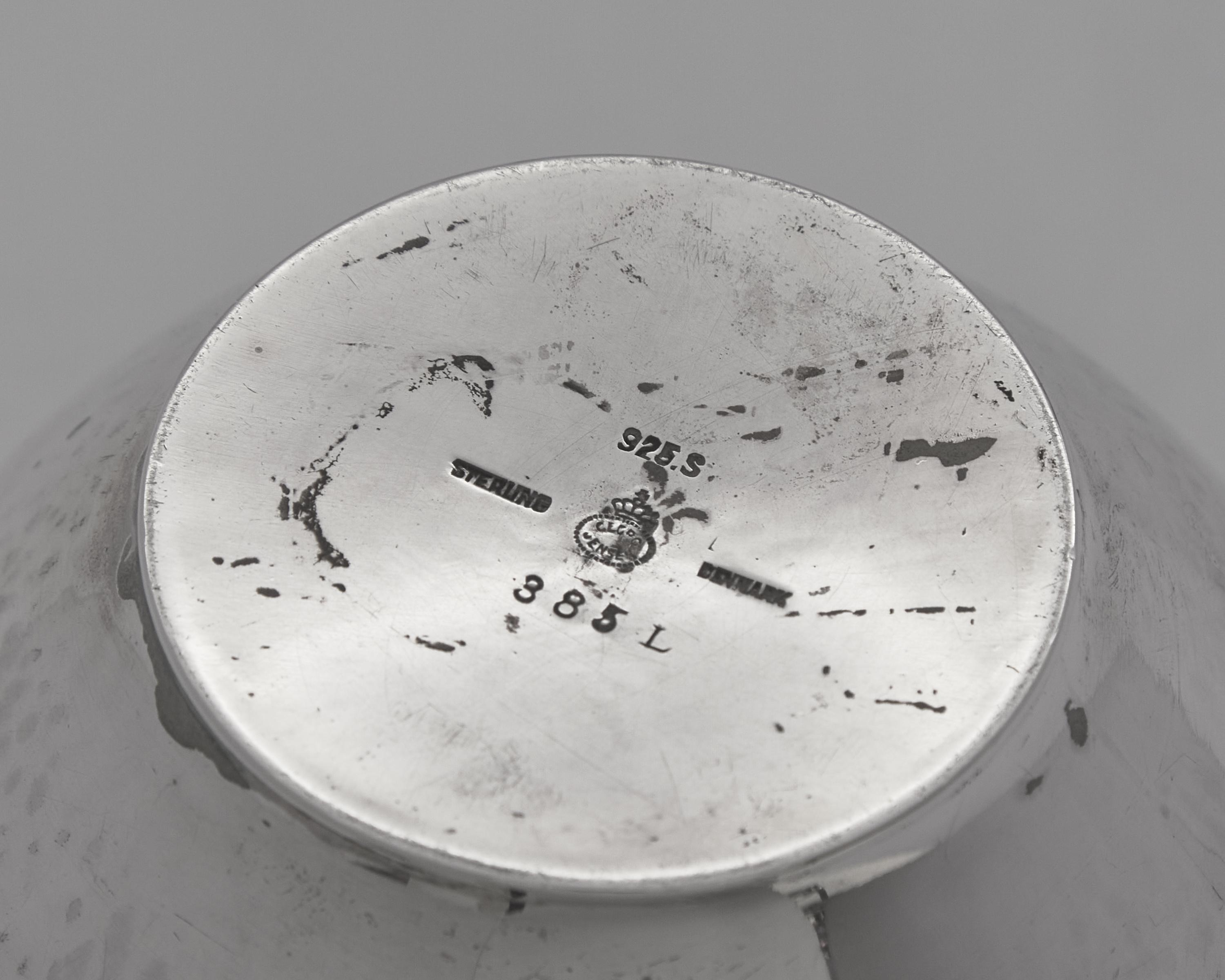A Group of Four Georg Jensen Silver Pitchers