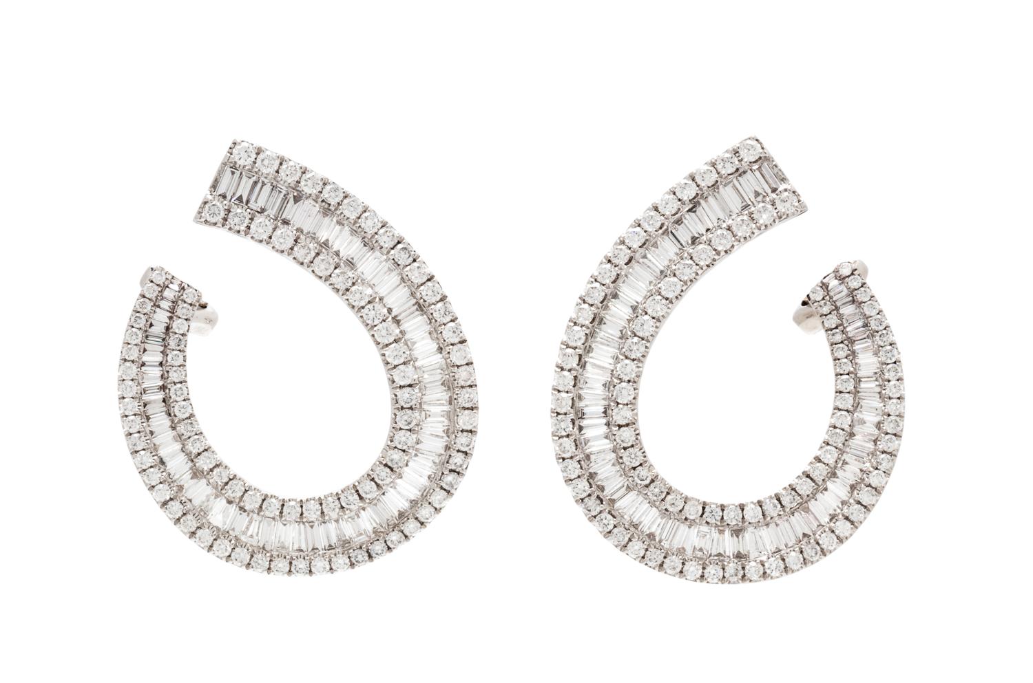 A Pair of 18 Karat White Gold and Diamond Earclips, 6.30 dwts.