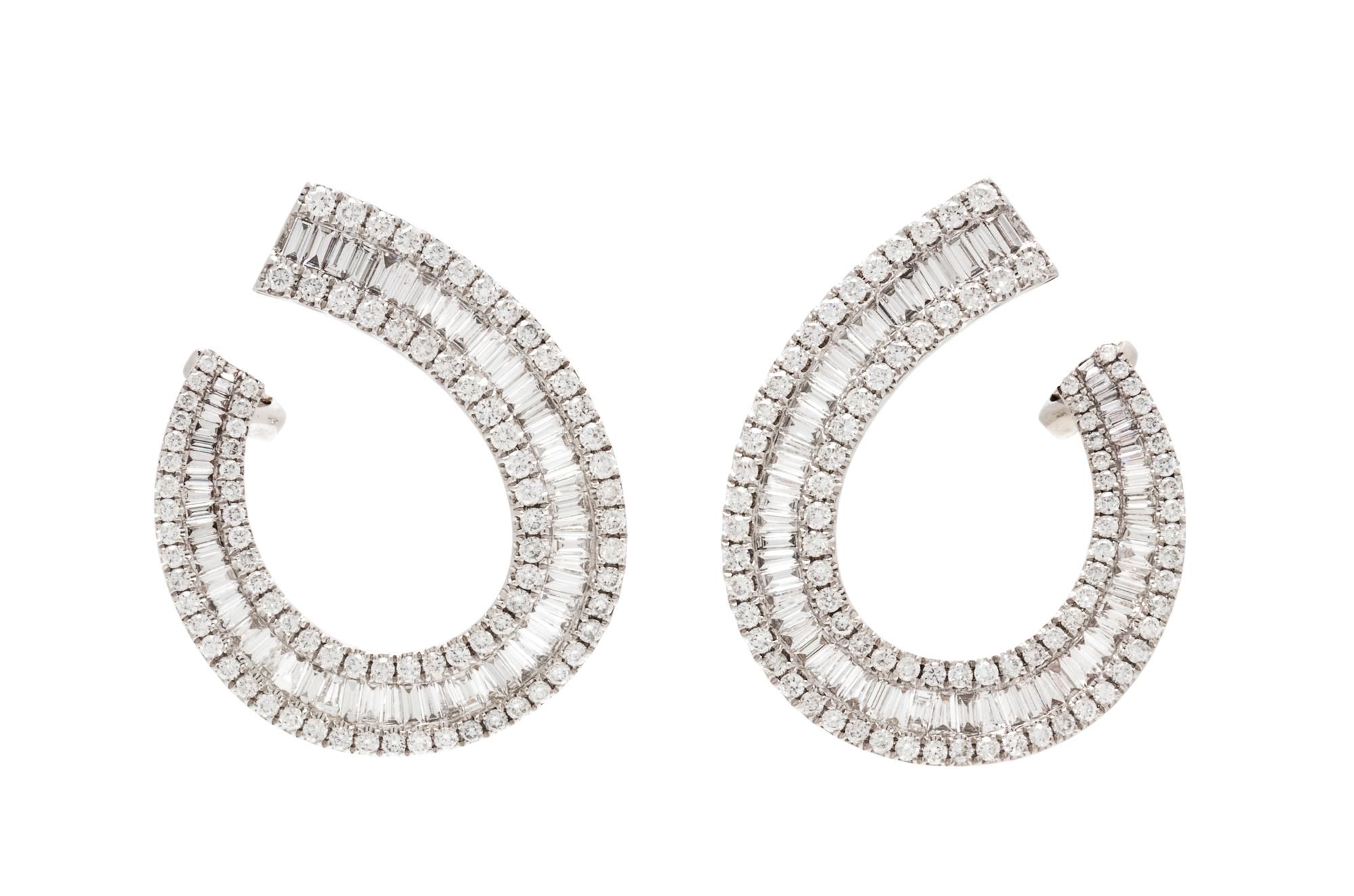 A Pair of 18 Karat White Gold and Diamond Earclips, 6.30 dwts.