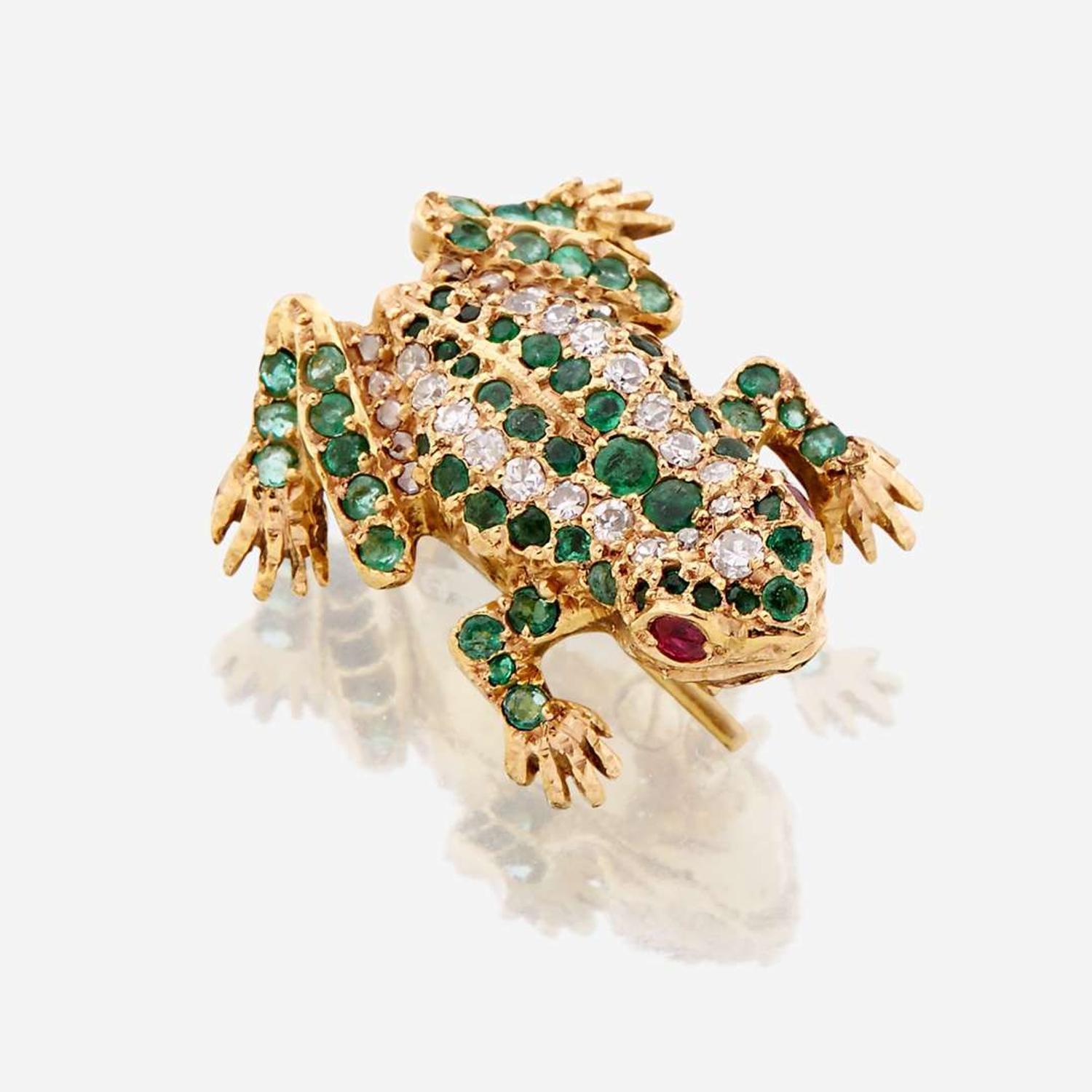 A fourteen karat gold, diamond, emerald, and ruby brooch
