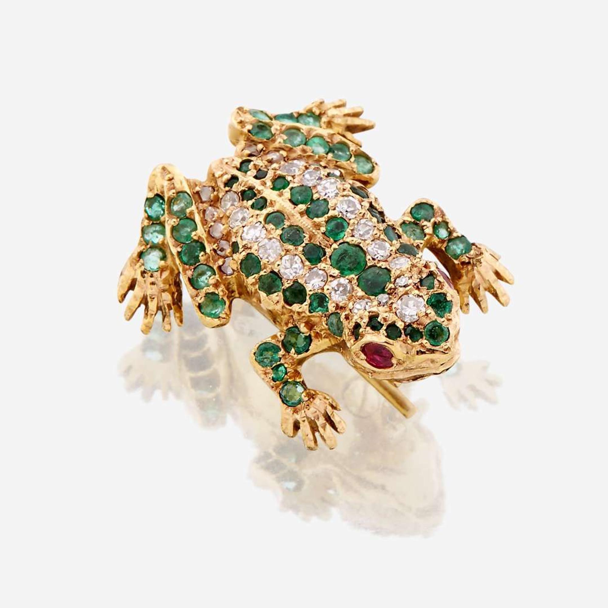 A fourteen karat gold, diamond, emerald, and ruby brooch