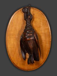 A Pair of Black Forest Style Carved Wood Game Plaques