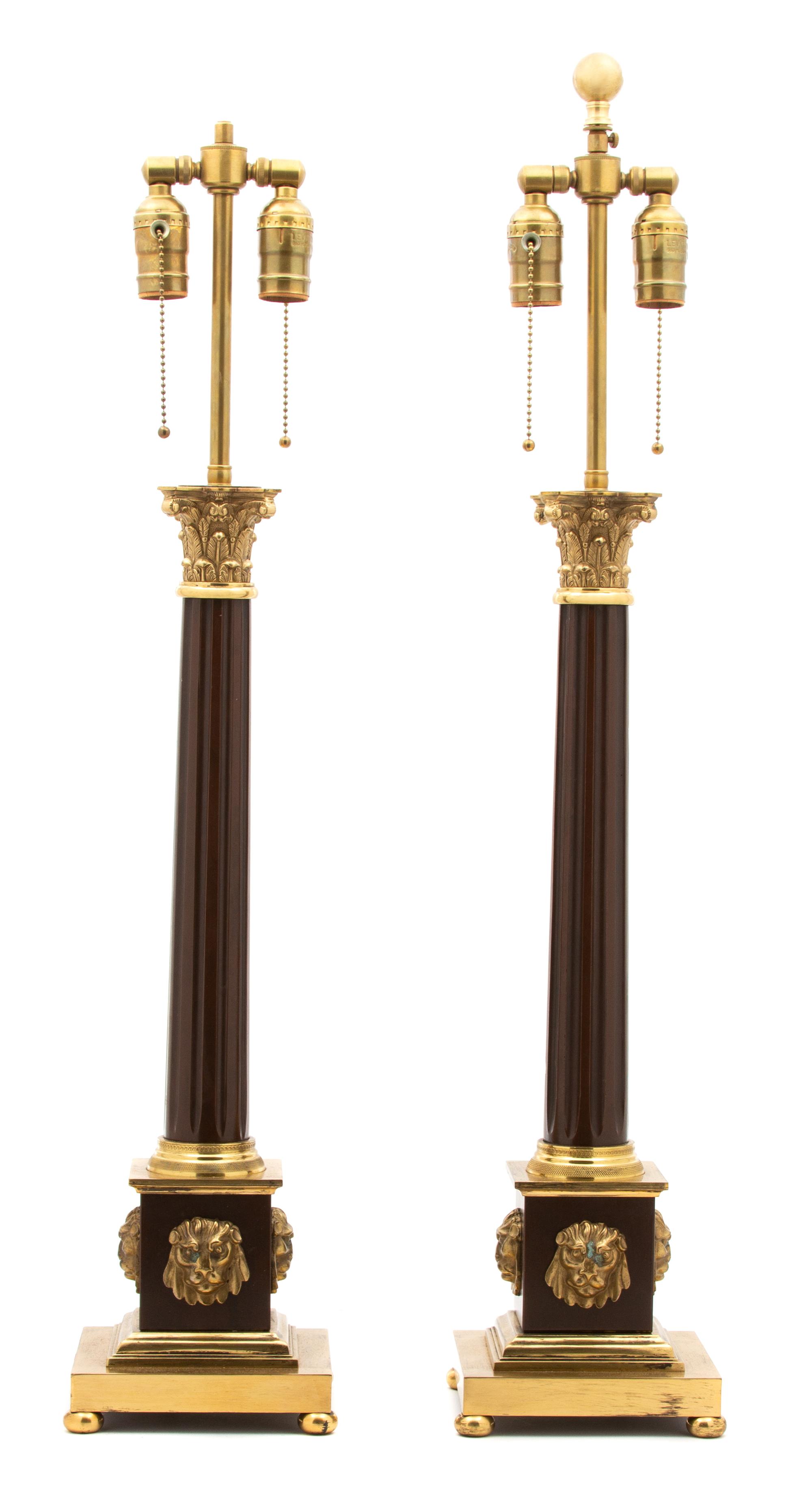 A Pair of Neoclassical Style Columnar Brass and Tole Lamps Height 30 inches. — 20TH CENTURY