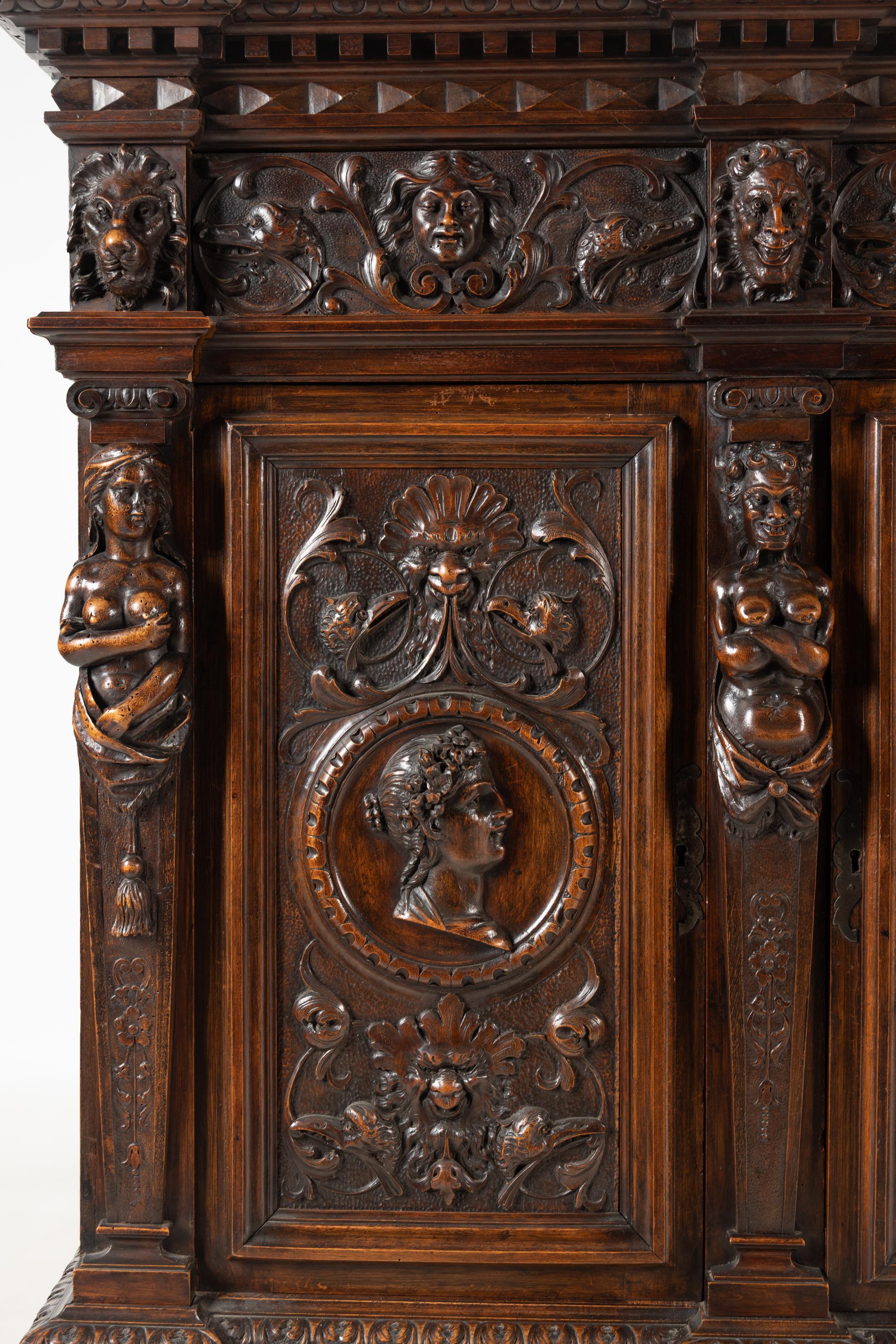 An Italian Renaissance Style Carved Walnut Cabinet