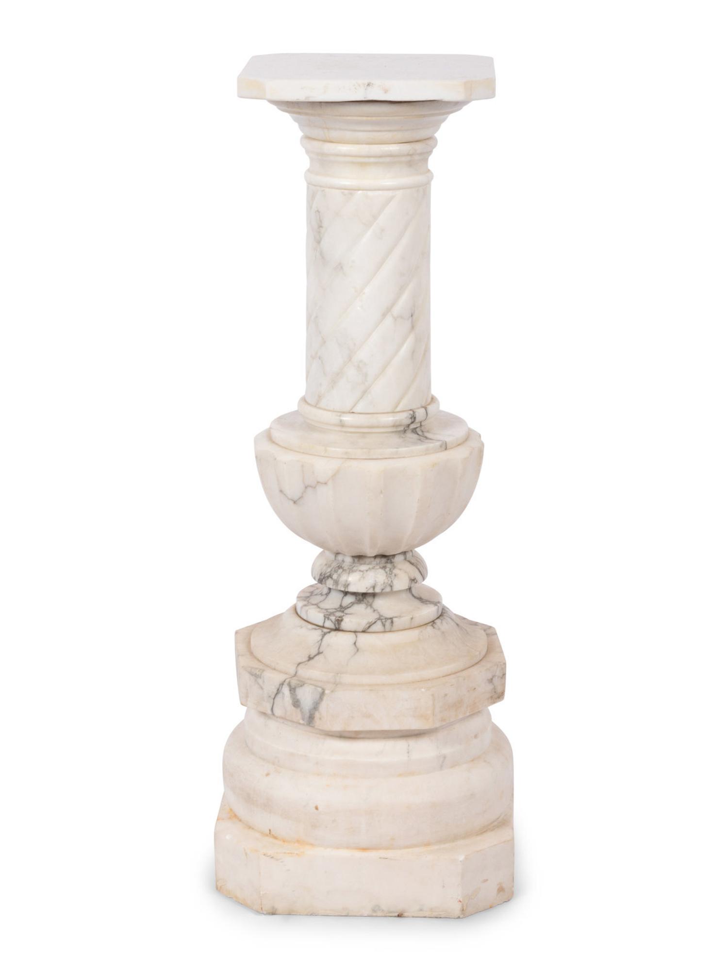 A Pair of Continental Carved Marble Pedestals