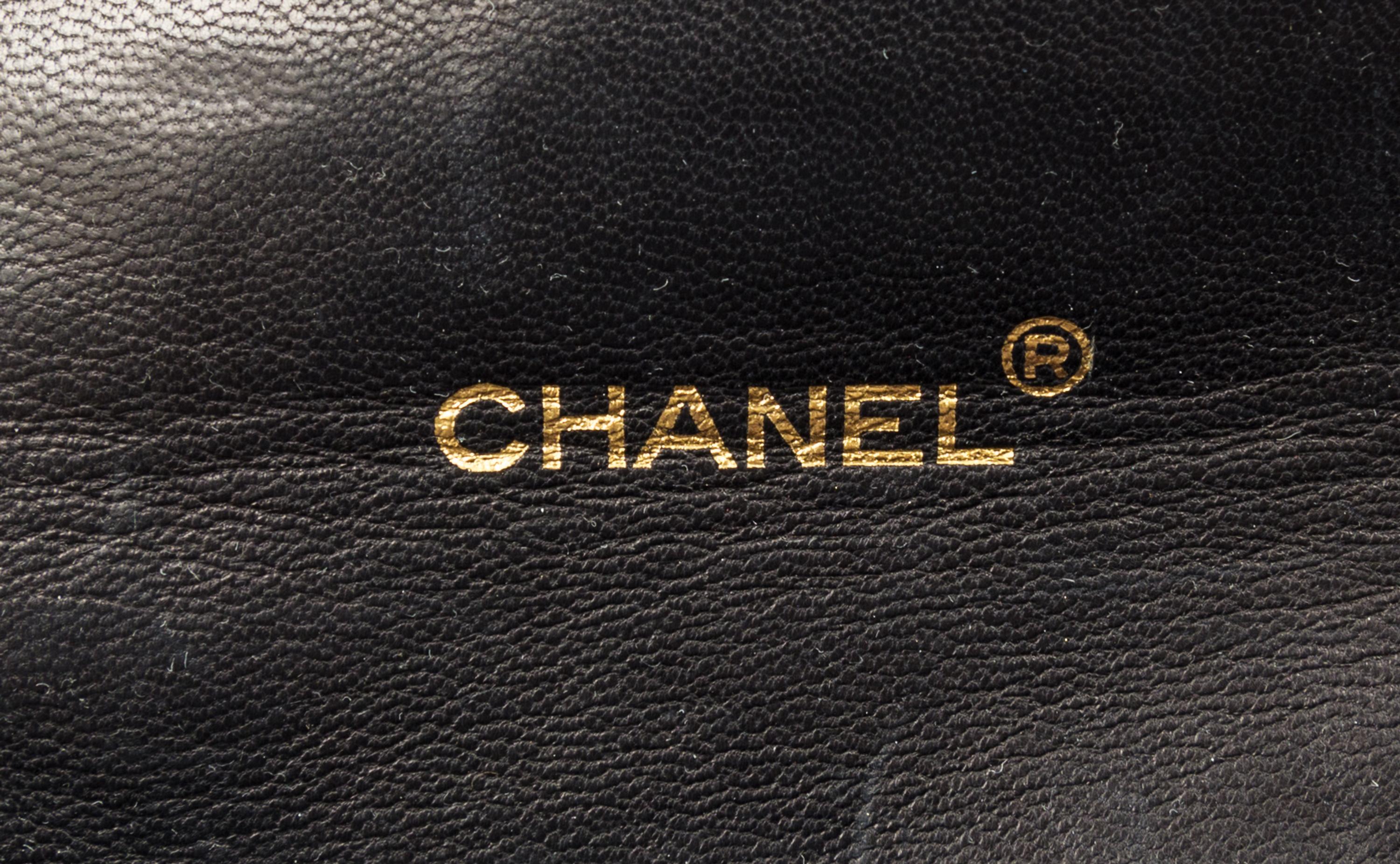 A Chanel Navy Classic Leather Handbag, 8.5" x 6.5" x 3".