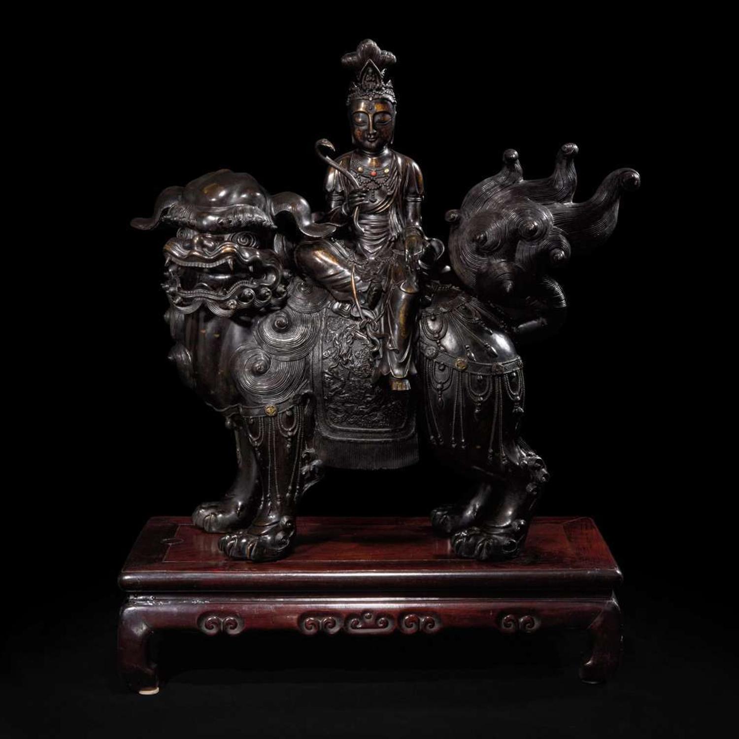 A large Japanese patinated bronze figural censer depicting a Bodhisattva on a lion 日本铜加漆菩萨骑狮像 19th/20th century ???????