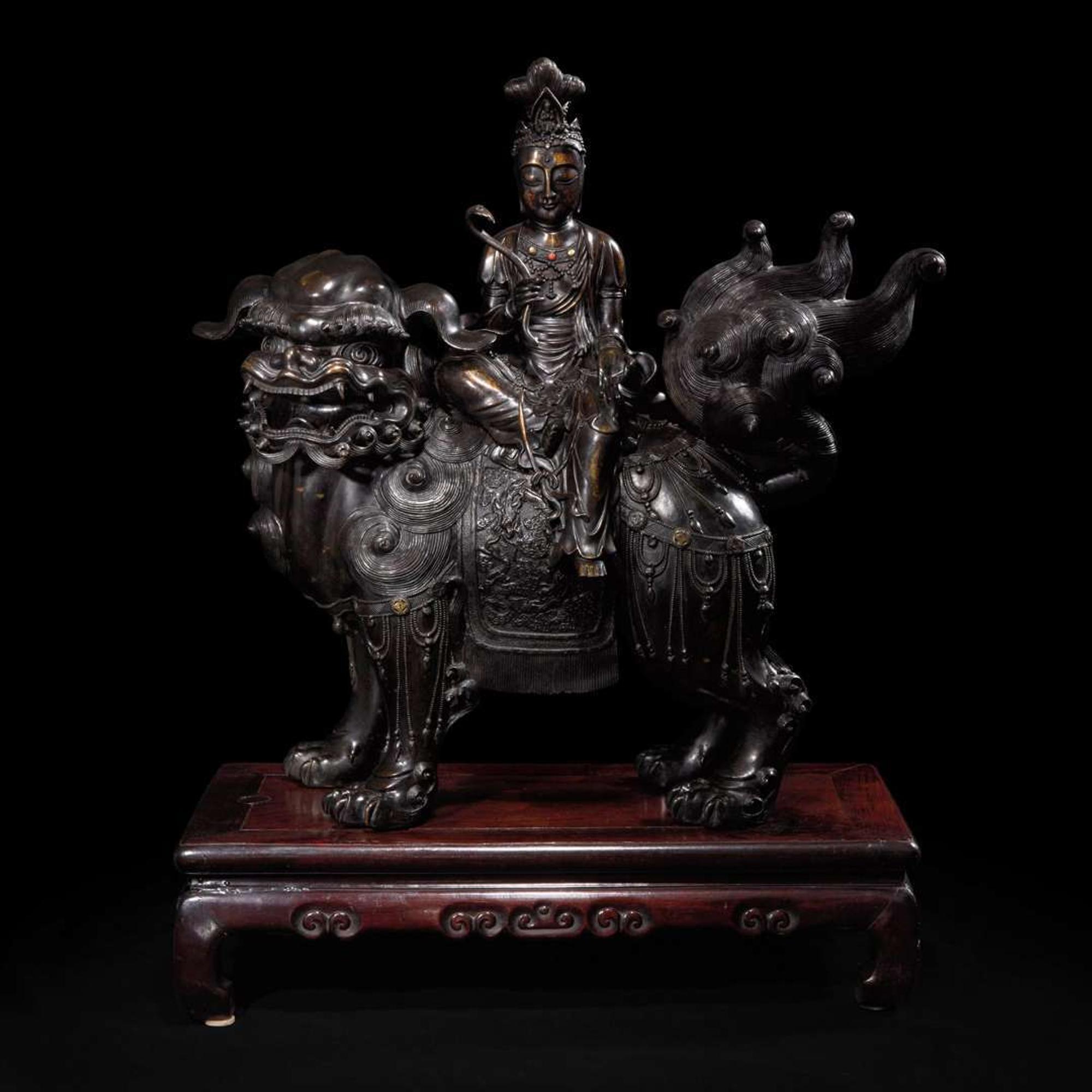 A large Japanese patinated bronze figural censer depicting a Bodhisattva on a lion 日本铜加漆菩萨骑狮像 19th/20th century ???????