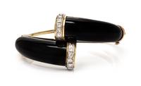 A 14 Karat Yellow Gold, Onyx and Diamond Bangle, 30.00 dwts.