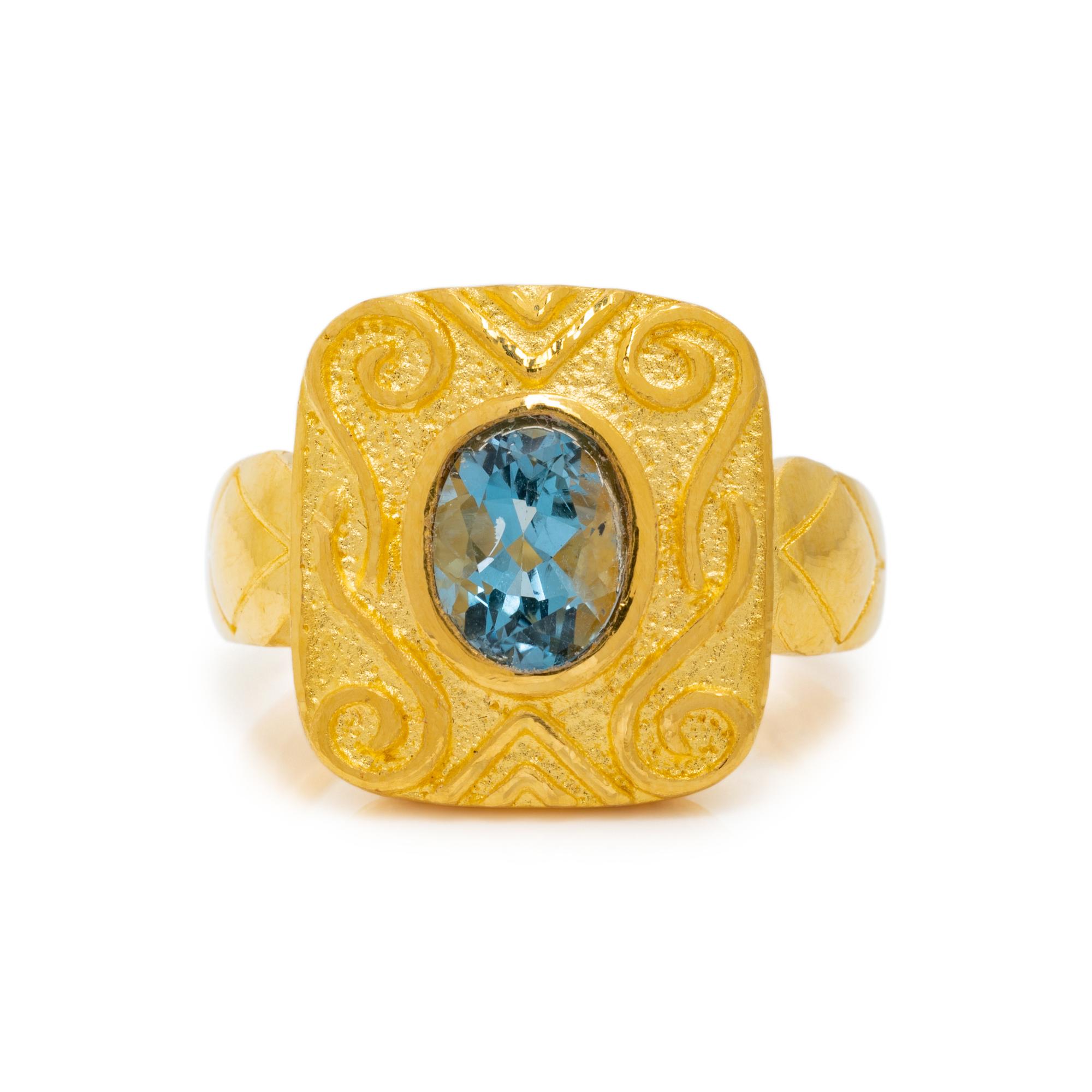 HIGH KARAT GOLD AND BLUE TOPAZ RING