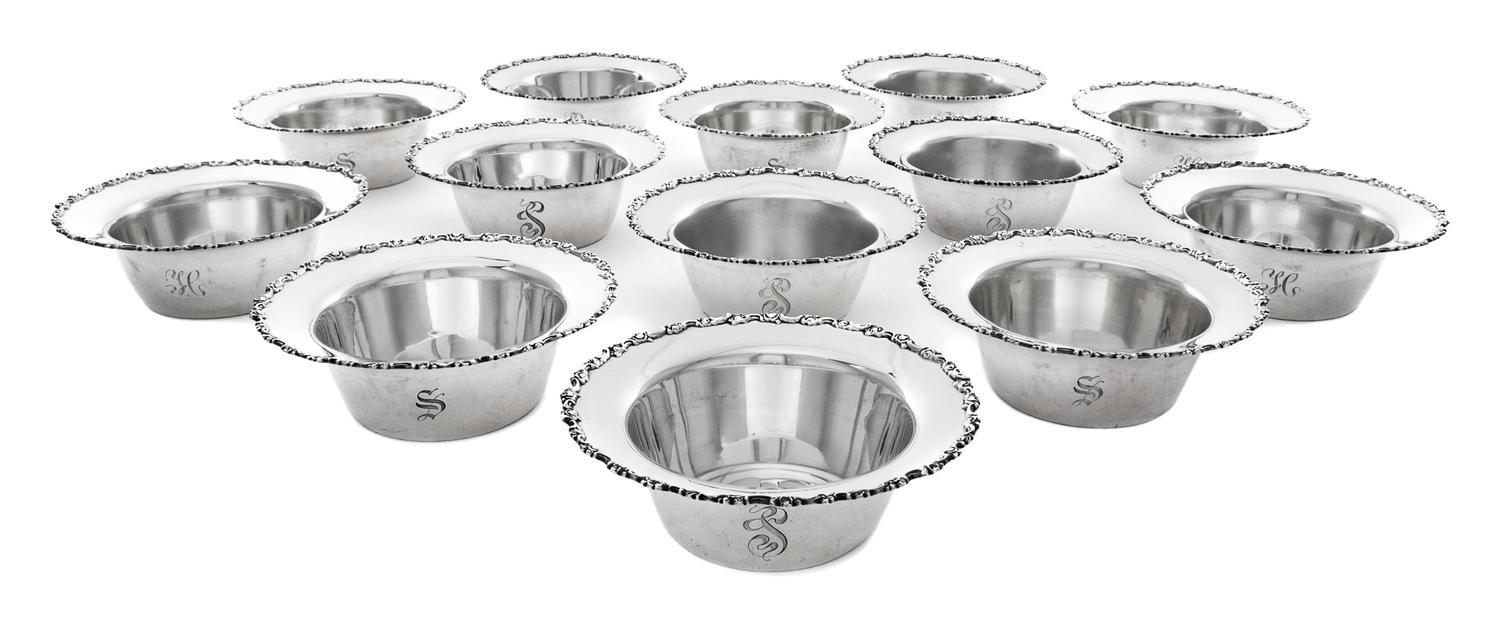 A Set of Twenty-Two American Silver Nut Dishes, Shreve & Co., San Francisco, CA, 20th Century, the rim worked with C-scroll and floral