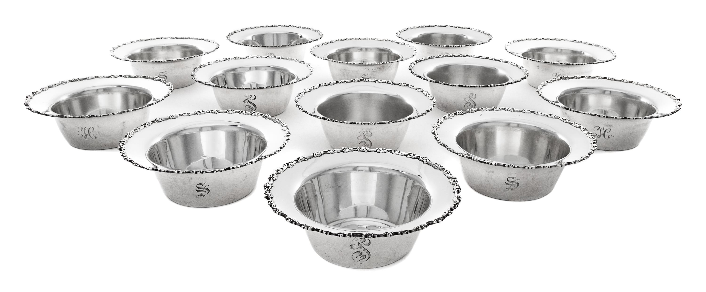 A Set of Twenty-Two American Silver Nut Dishes, Shreve & Co., San Francisco, CA, 20th Century, the rim worked with C-scroll and floral