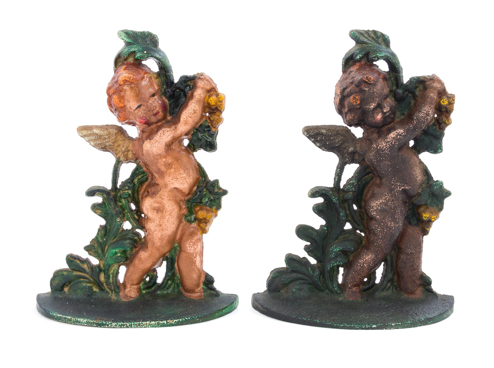 A Pair of Cast Iron Doorstops Height 11 1/4 inches.