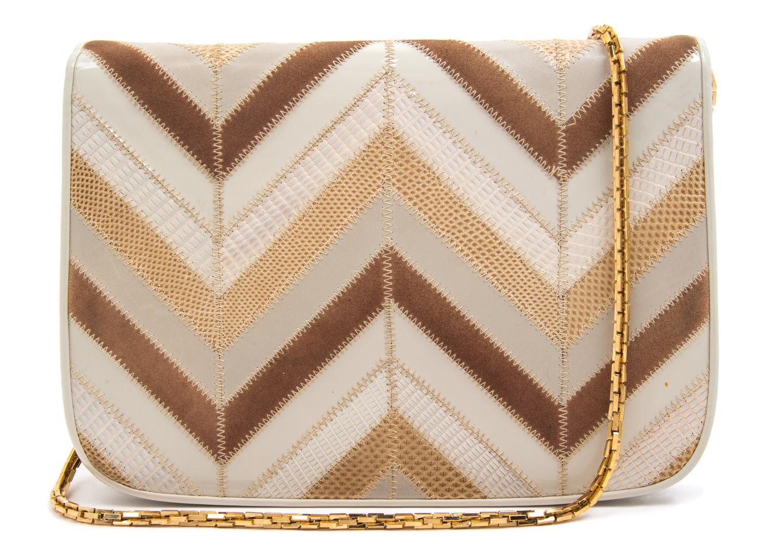 A Judith Leiber Cream Patent Leather Chevron Handbag, 9.5" x 7" x 1.5".