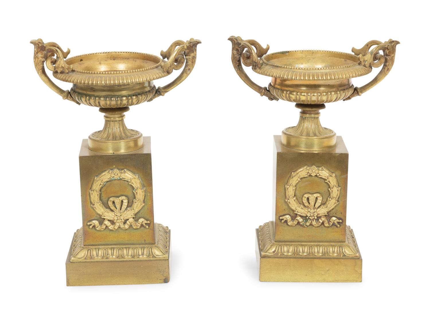 A Pair of Empire Gilt Bronze Urns on Pedestal Bases