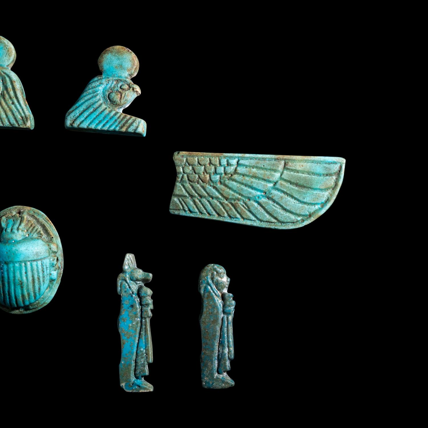 An Egyptian Faience Winged Scarab Set