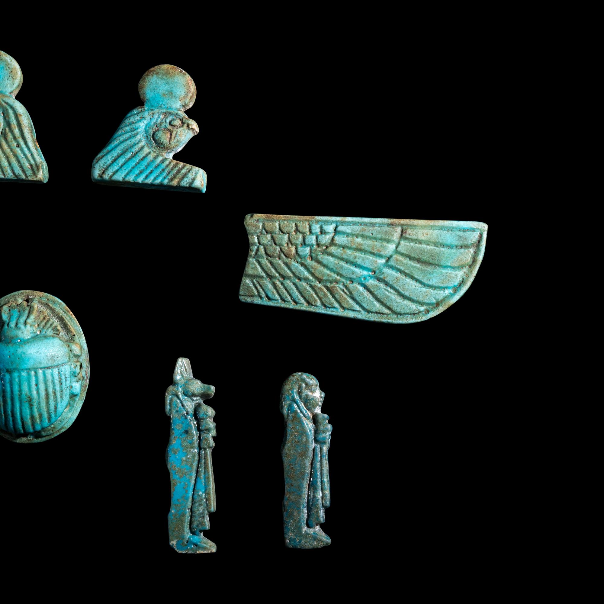 An Egyptian Faience Winged Scarab Set