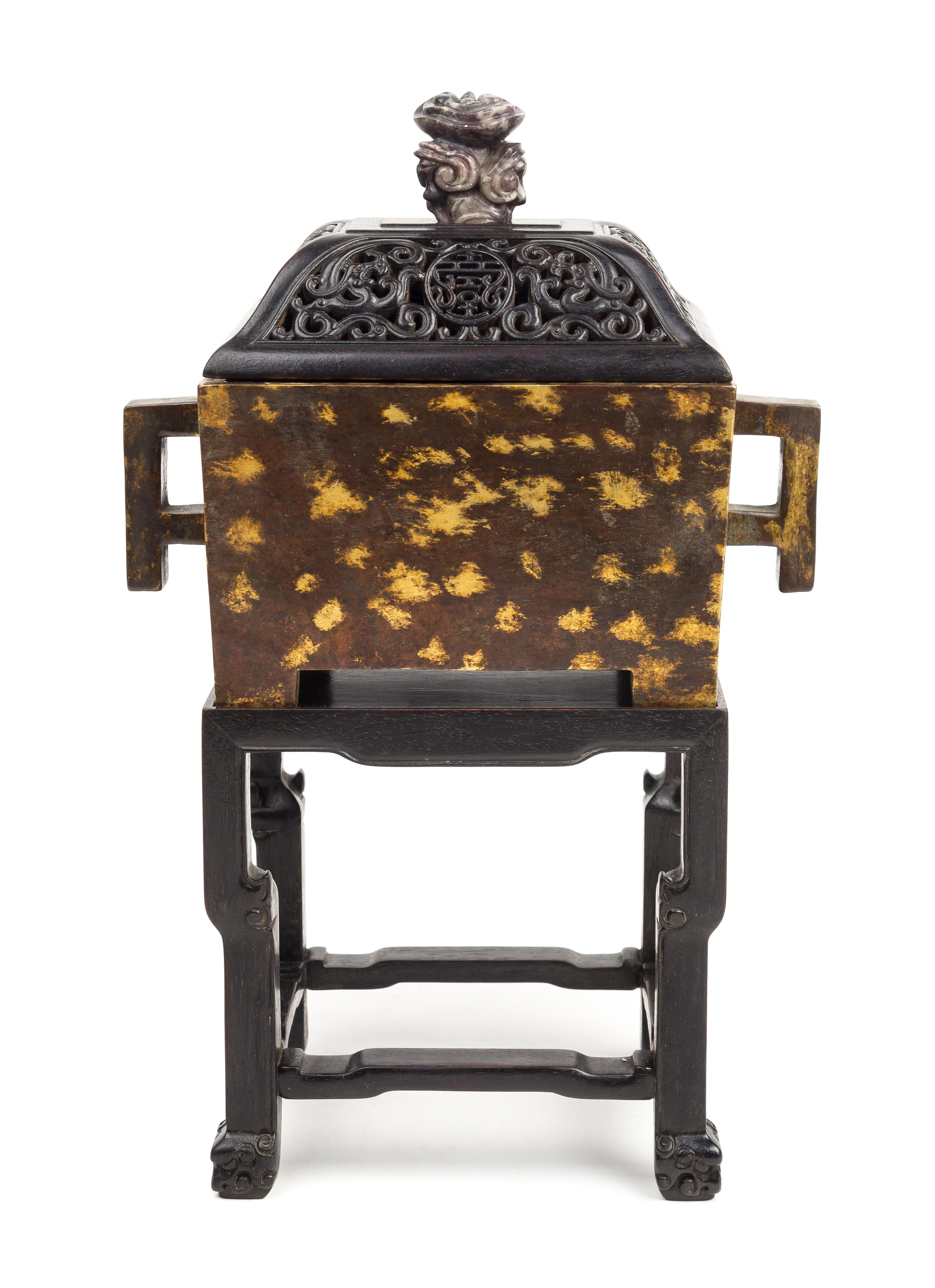 A Gilt-Splashed Bronze Rectangular Incense Burner Length 8 1/2 inches.