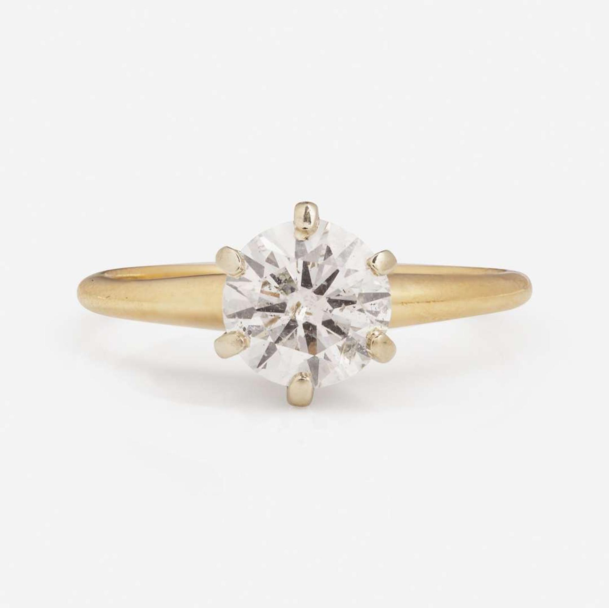 A 14K Yellow Gold Solitaire Diamond Ring