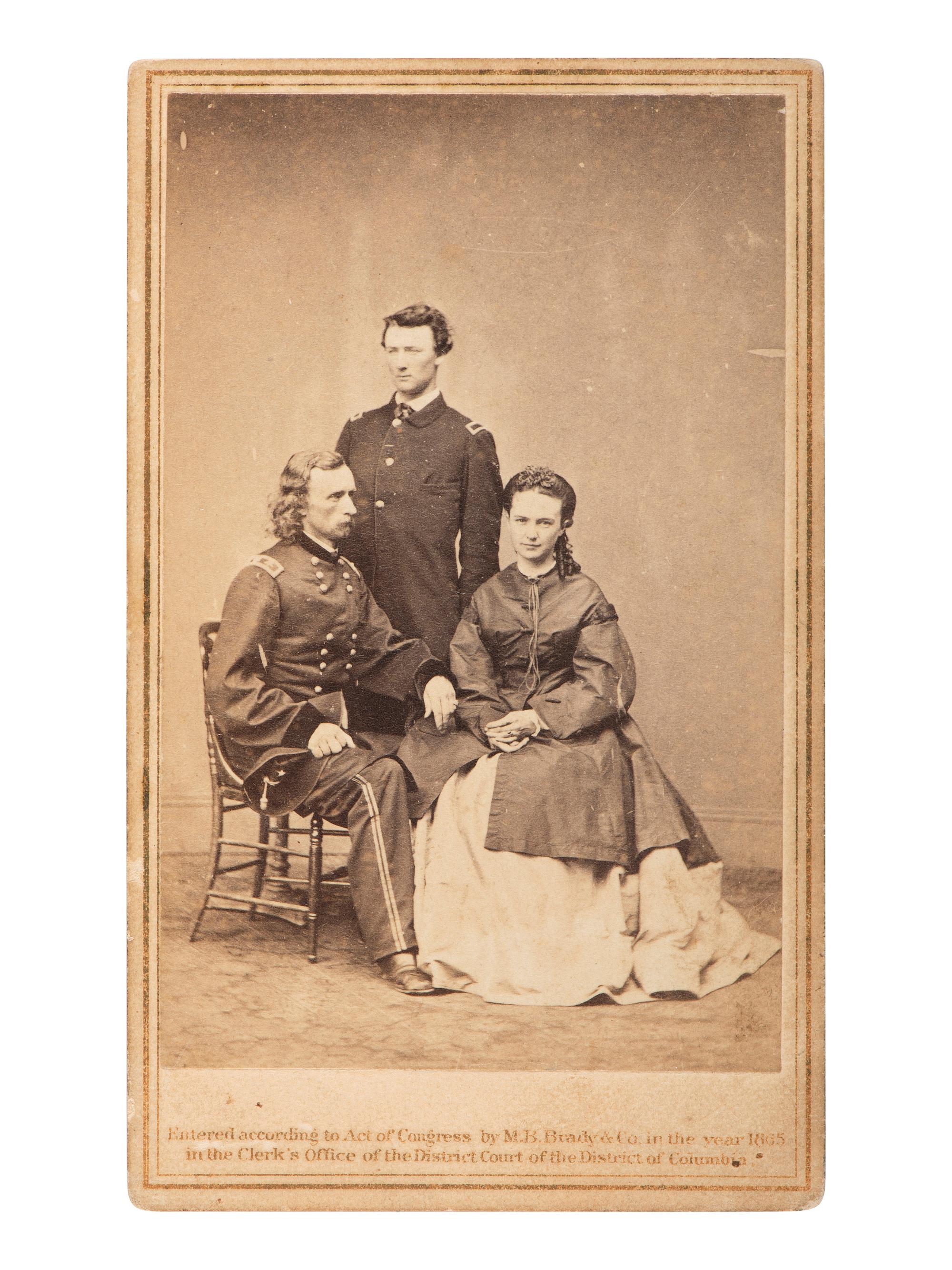 [CUSTER, George Armstrong (1839-1876)]. CDV of George, Libby, and Tom Custer. Washington, DC: Mathew Brady, 1865.