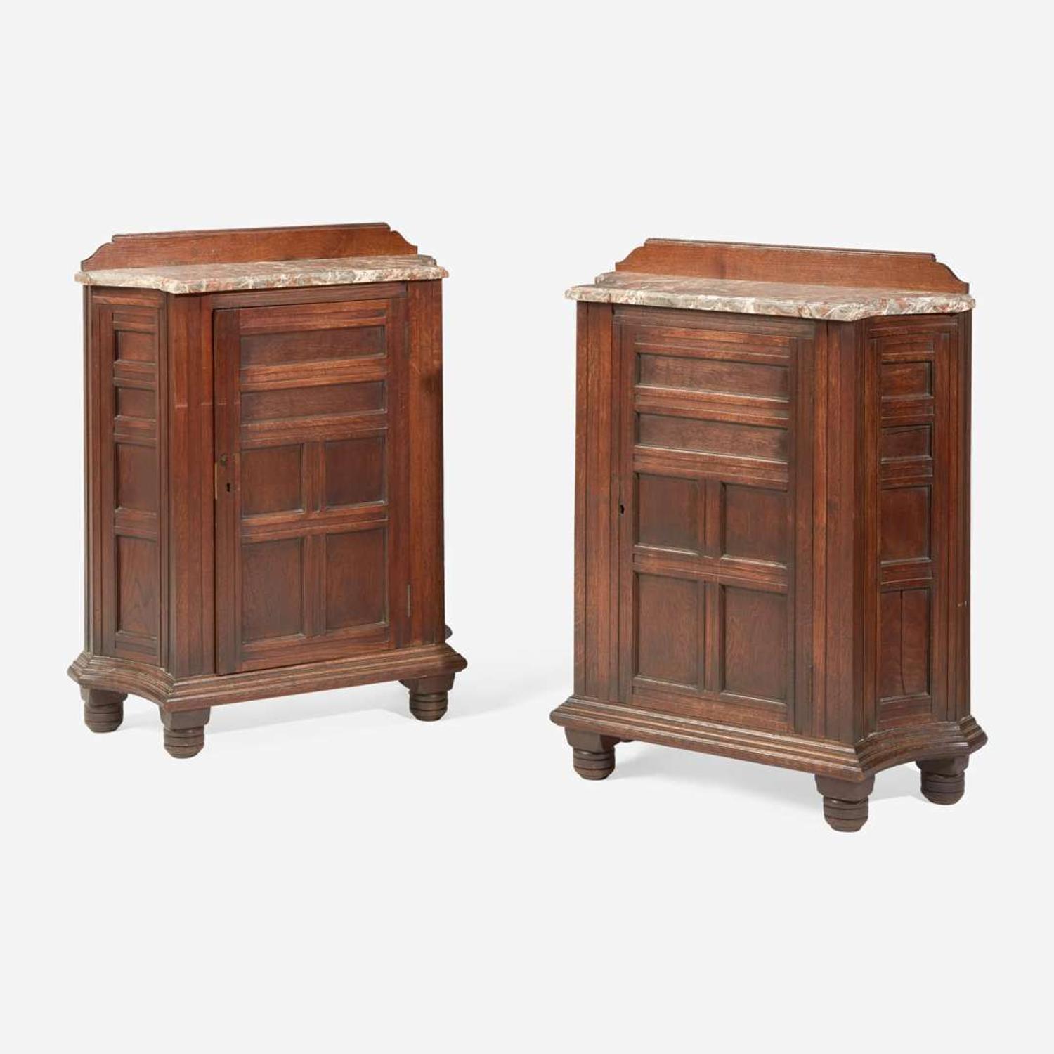 A pair of English Aesthetic Movement oak cabinets with Languedoc marble tops Attributed to Philip Webb (English, 1831-1915), England, circa 1870