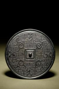 A Bronze Circular 'Phoenix’ Mirror