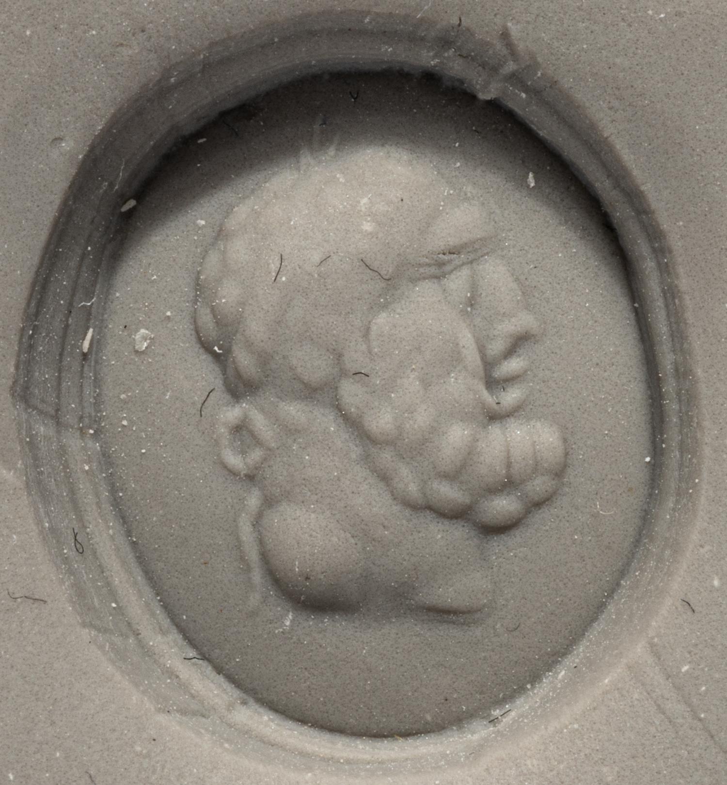 A Roman Banded Agate Ring Stone with the Portrait Head of a Bearded Hercules