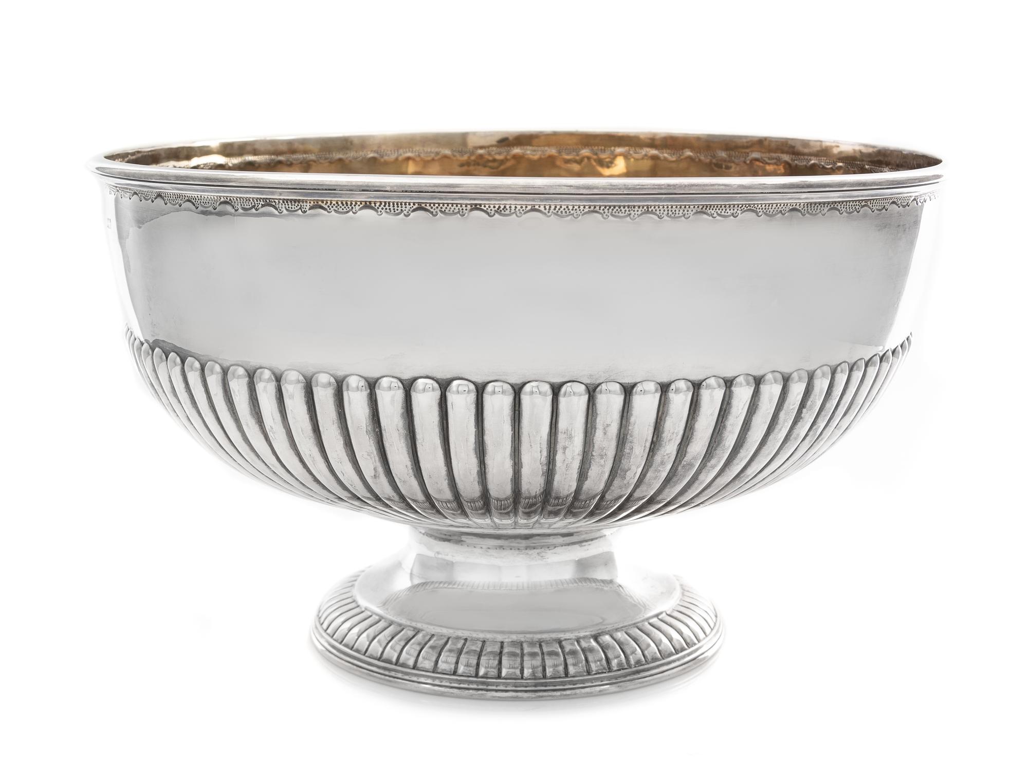 A Victorian Silver Center Bowl, Atkins Bros., Sheffield, 1894, the bowl with a fluted band, raised on a flared foot with a fluted rim.