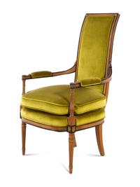 A Louis XVI Style Parcel Ebonized Walnut Fauteuil