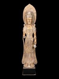 A Chinese Carved Stone Guanyin with Lotus Crown and Remnants of Gilt