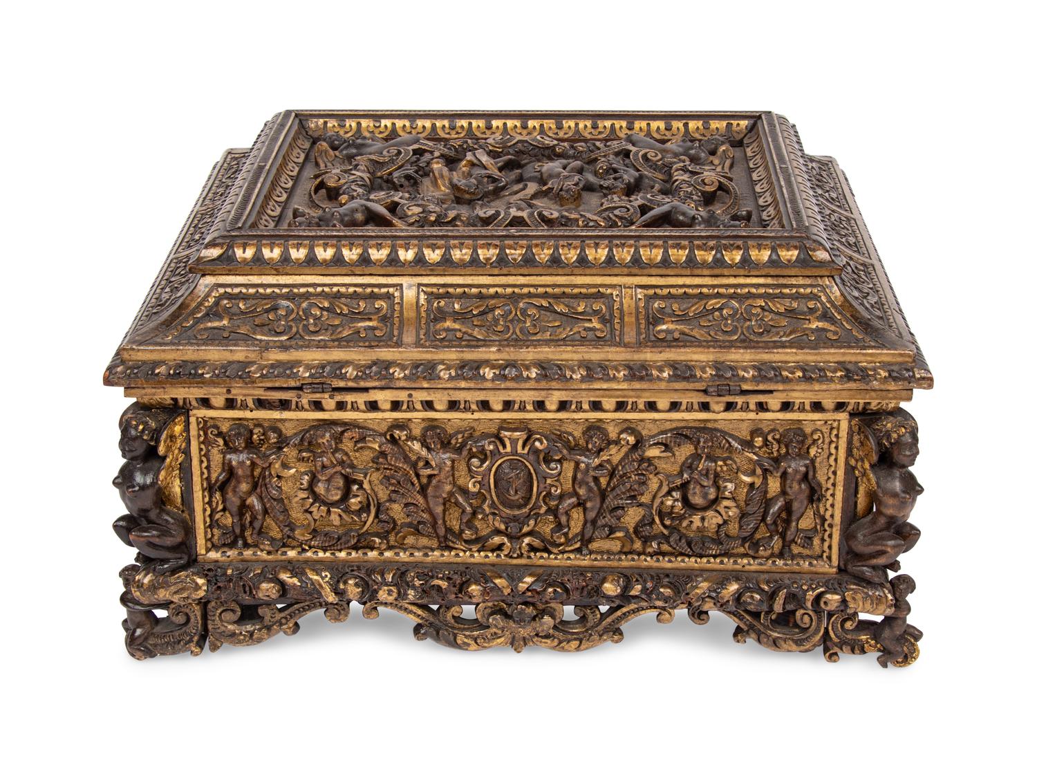 An Italian Parcel Gilt and Carved Walnut Orpheus and Eurydice Casket