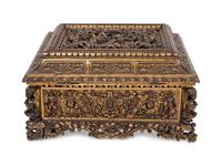 An Italian Parcel Gilt and Carved Walnut Orpheus and Eurydice Casket