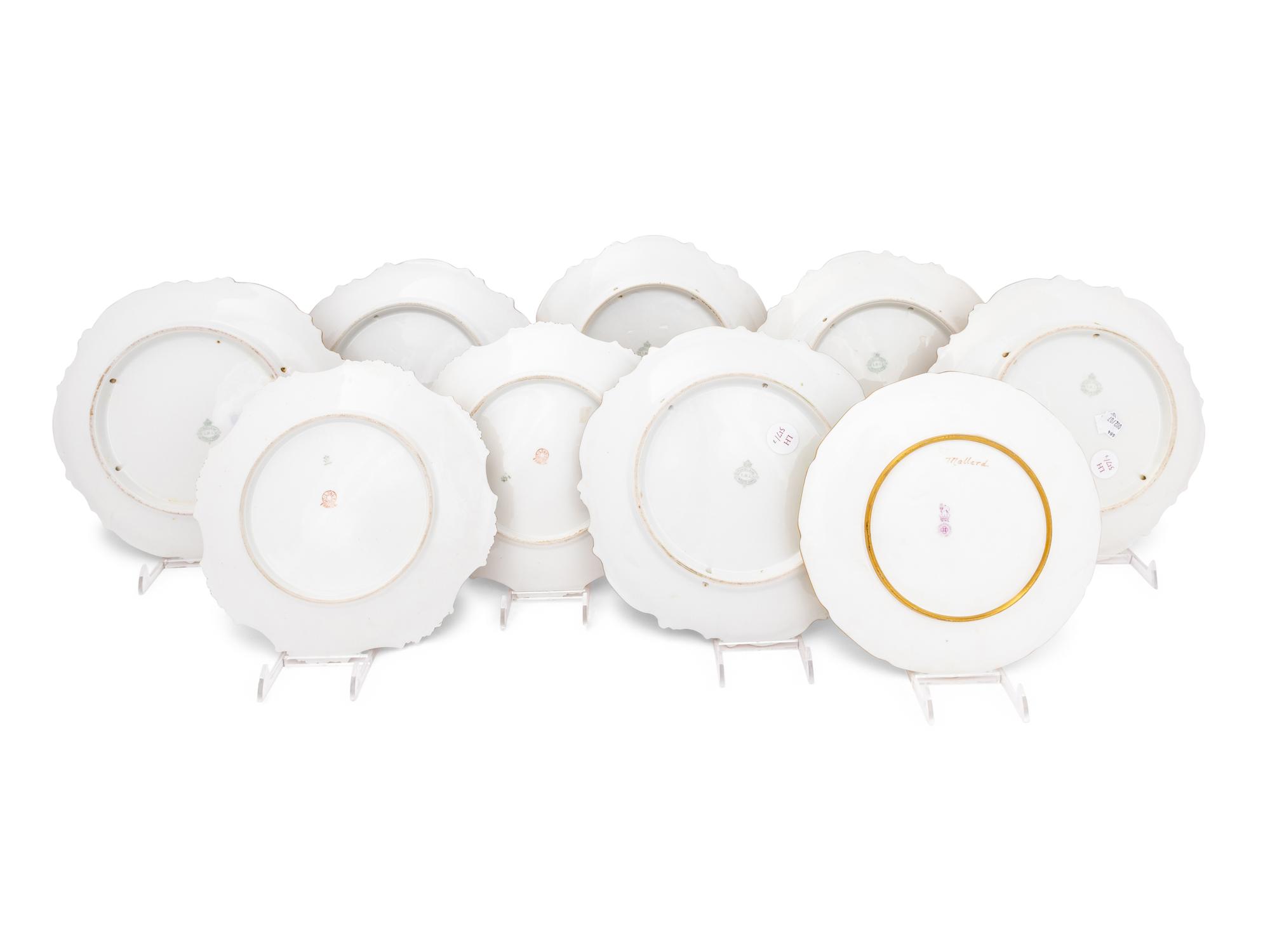 A Set of Eight Limoges Porcelain Fish and Game Plates