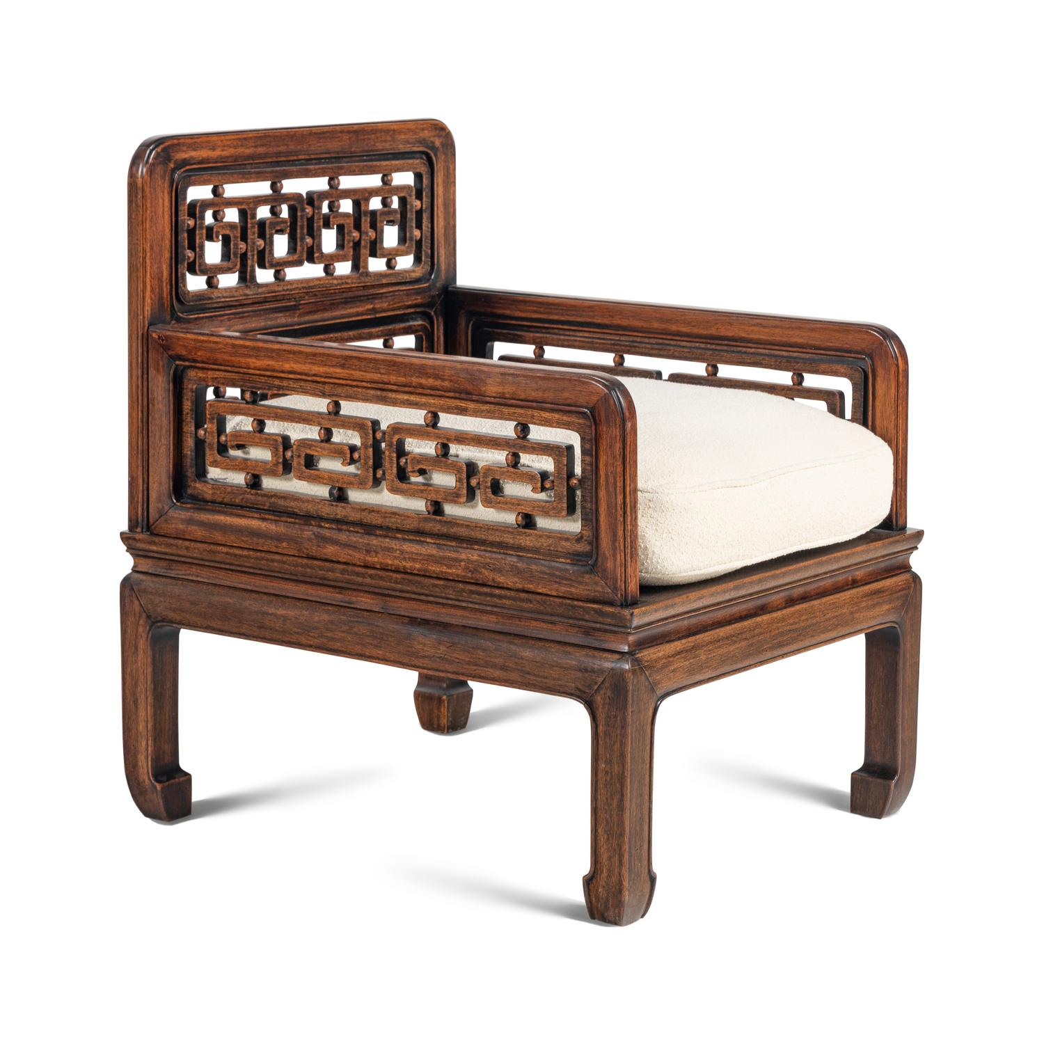A Pair of Indonesian Carved Hardwood Armchairs