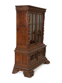 A German Black Forest Carved Oak Bookcase — Late 19th Century
