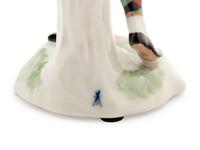 A German Porcelain Harlequin Figure