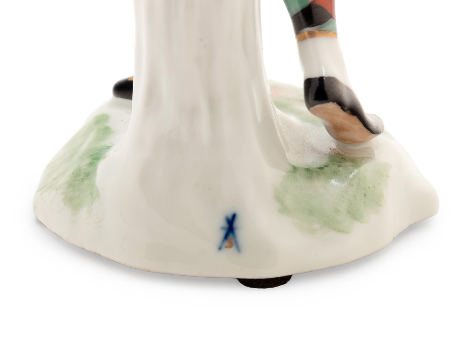 A German Porcelain Harlequin Figure