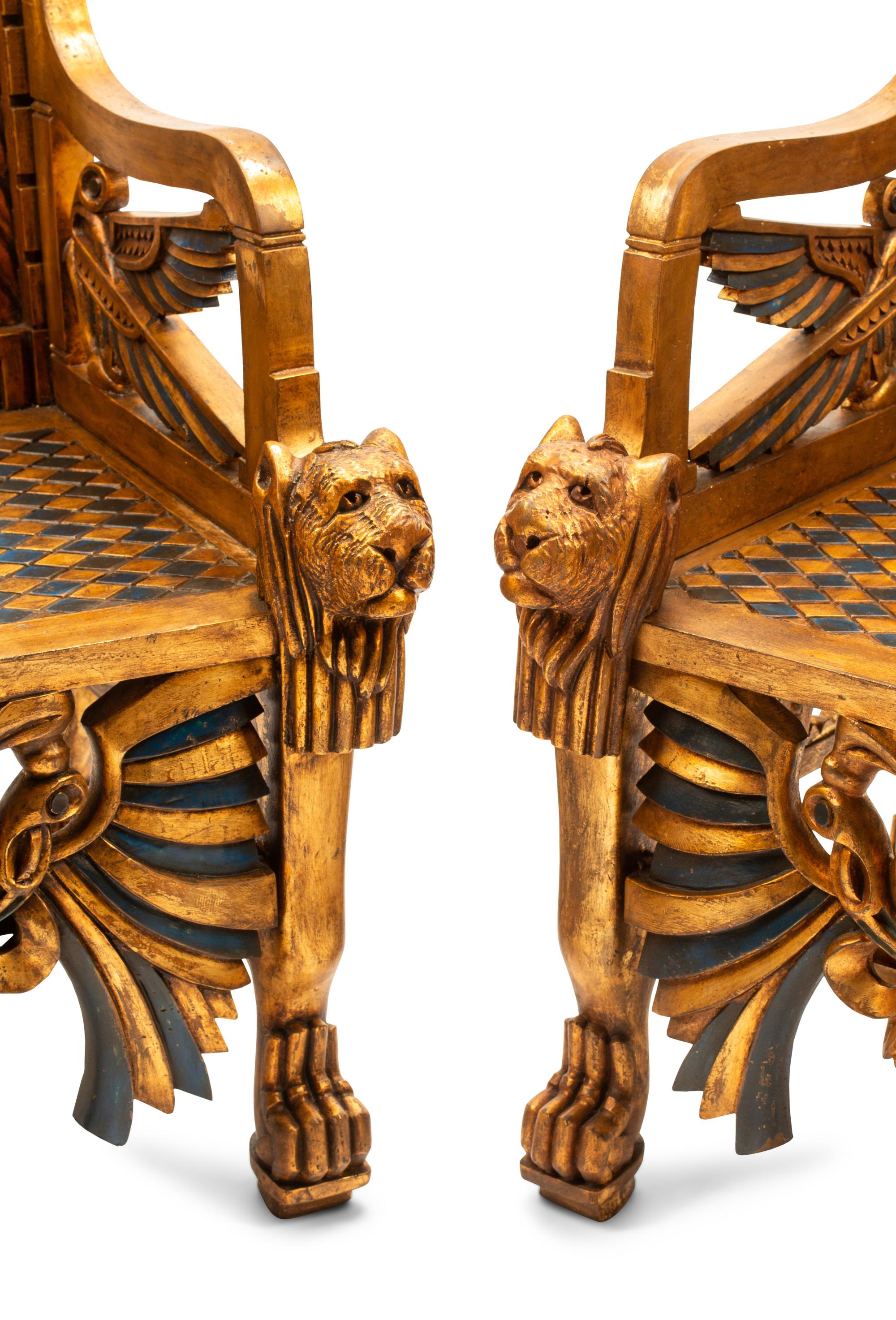 A Pair of Egyptianesque Painted and Giltwood Throne Chairs