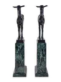 A Pair of Bronze Models of Pompeiian Deer on Marble Plinths