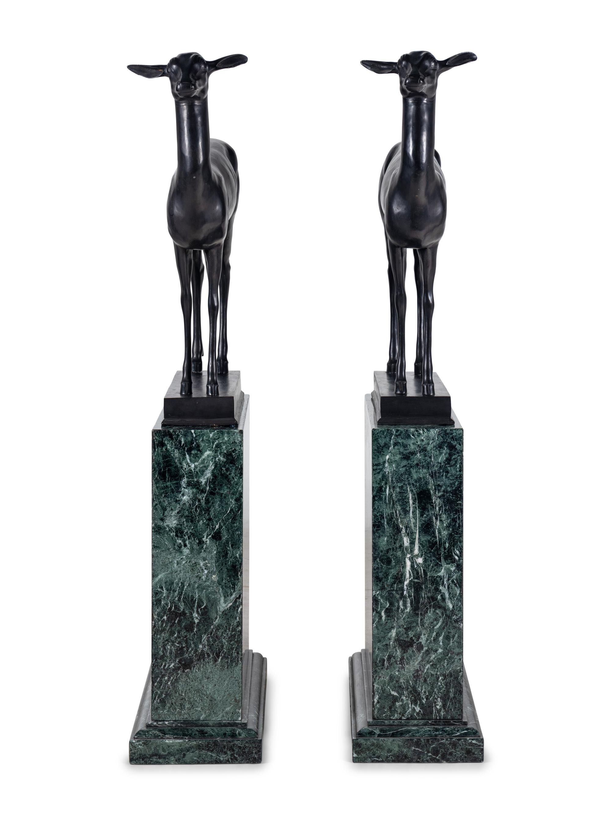 A Pair of Bronze Models of Pompeiian Deer on Marble Plinths