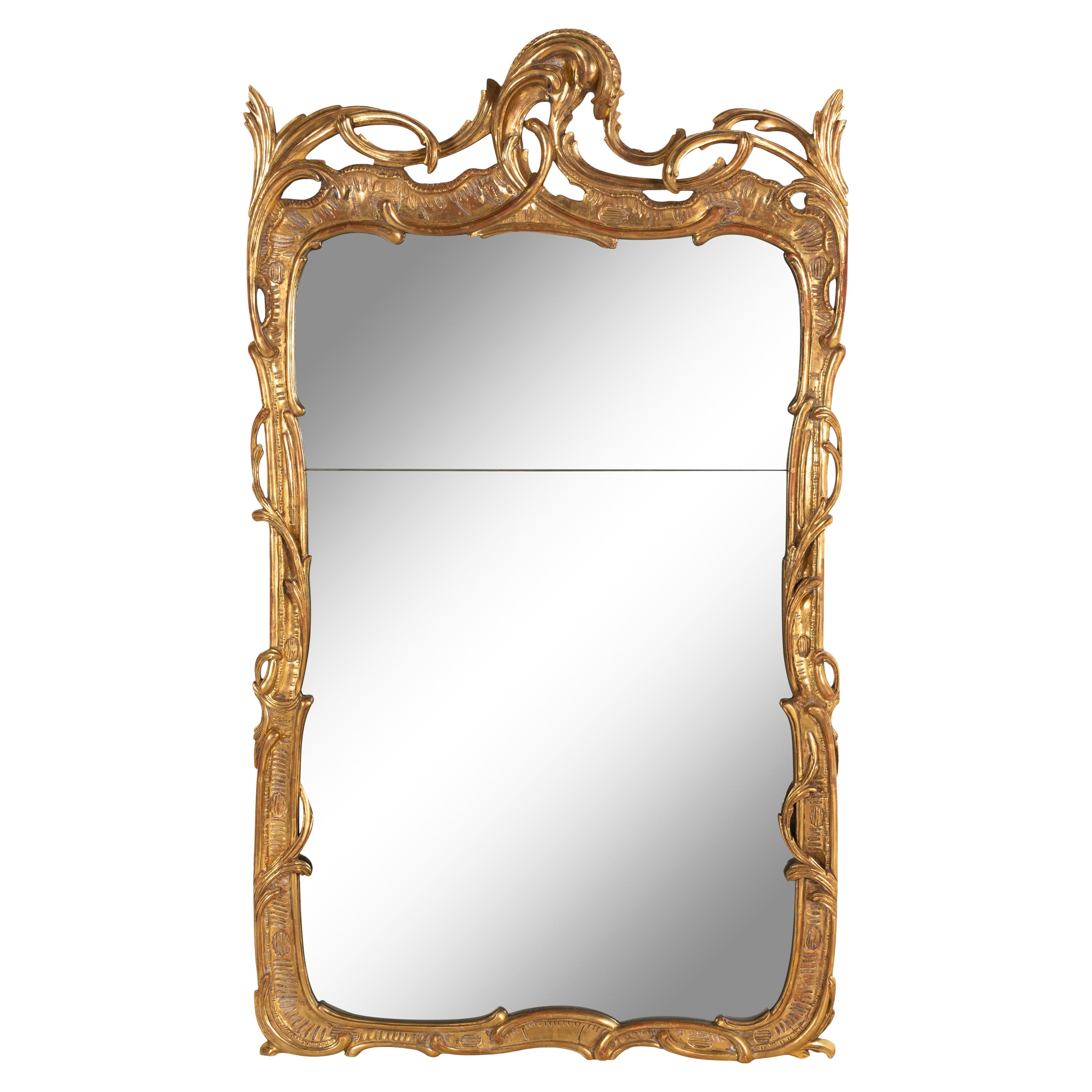A Rococo Style Giltwood Mirror